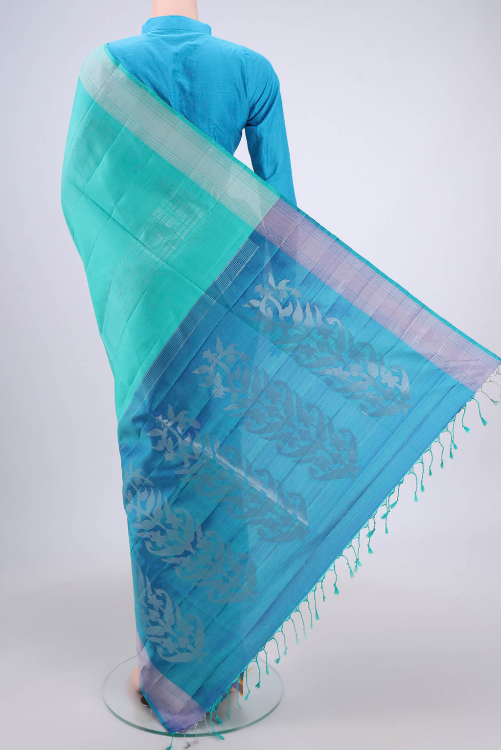 Flat view of Turquoise Soft Silk Saree with Stripes on the body and Zari Border. 