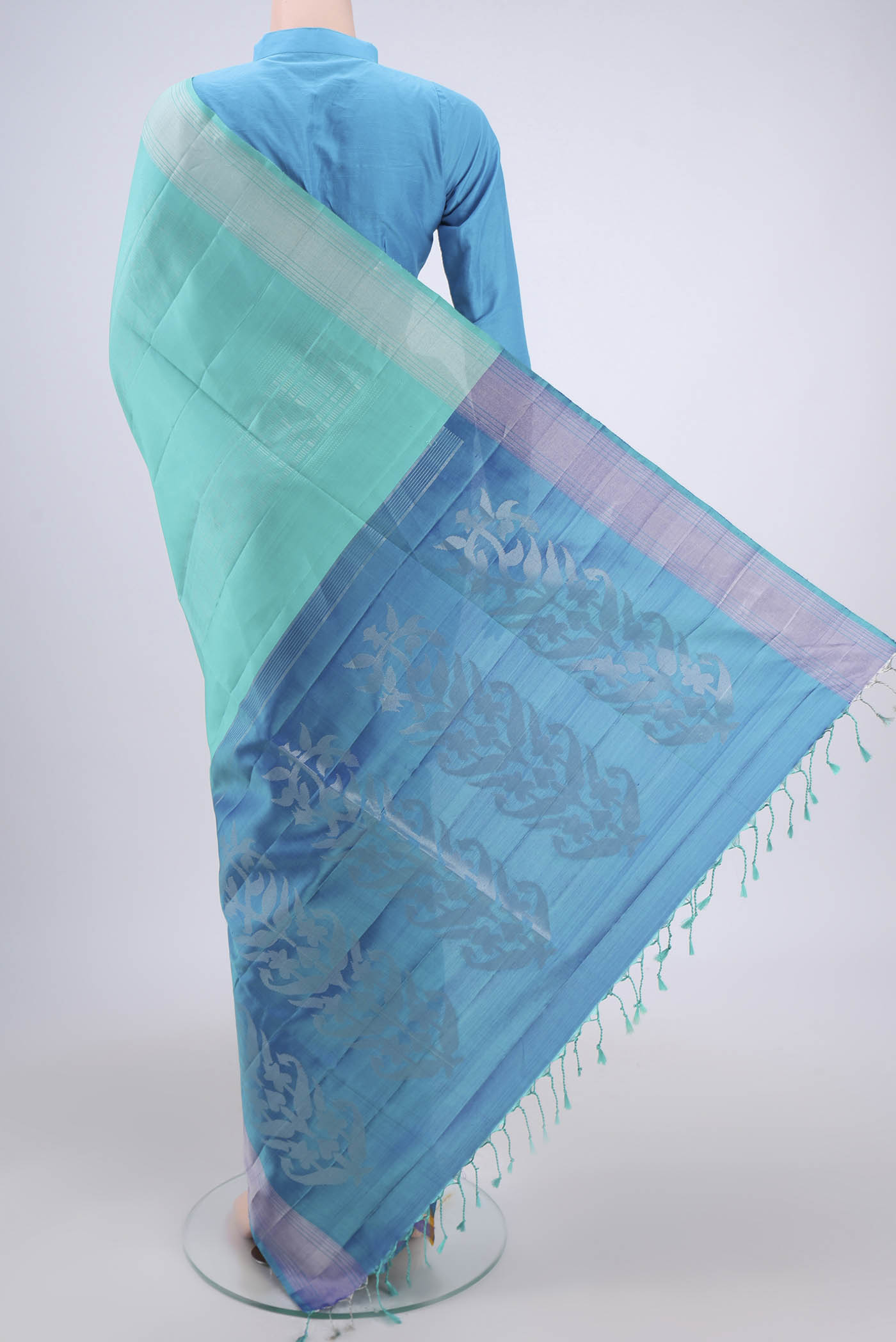 Flat view of Turquoise Soft Silk Saree with Stripes on the body and Zari Border. 