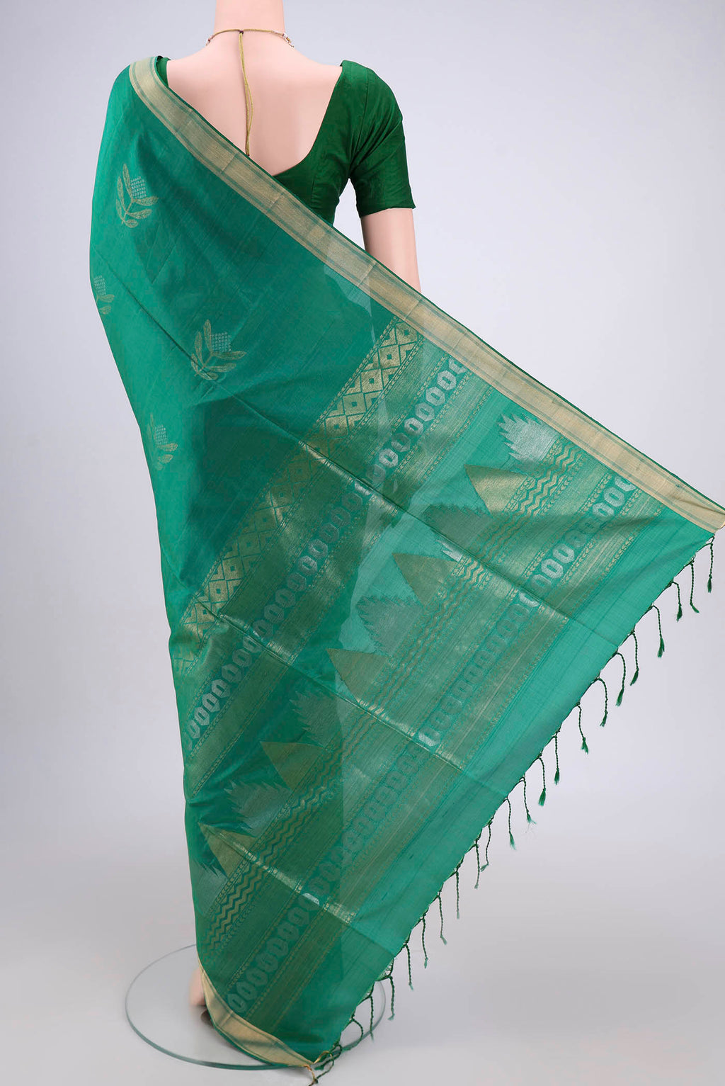 Flat view of Green Dual Tone Baluchari Silk Saree with Zari Butta on the body and Zari Border. 