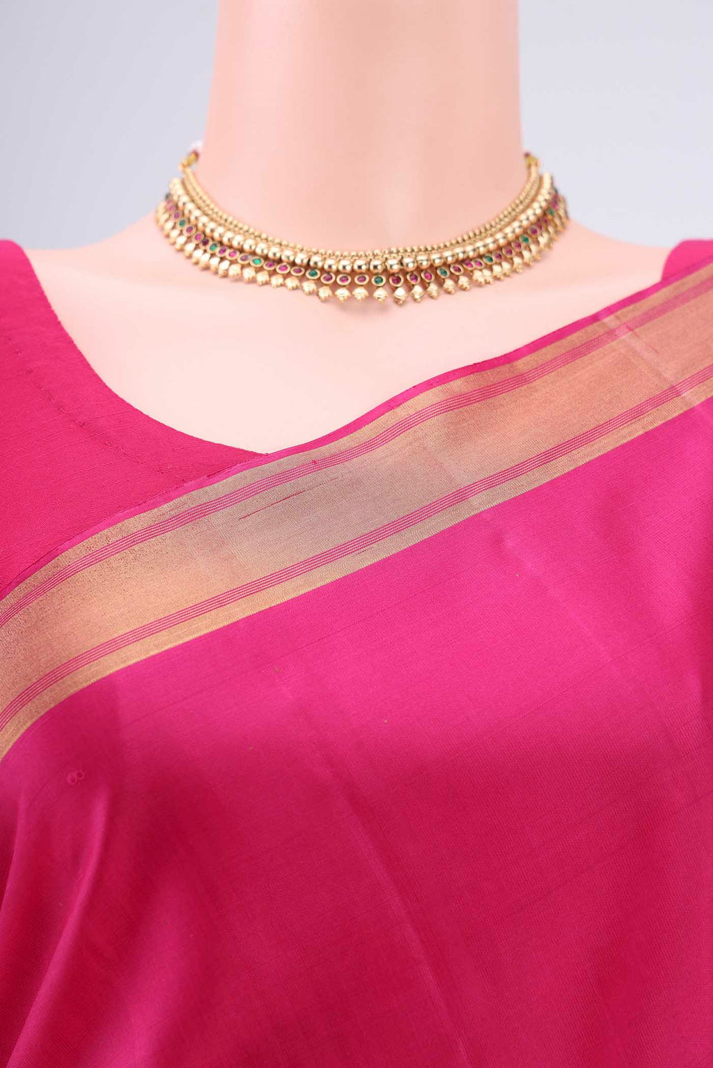 Border image of Rani Pink Baluchari Silk Saree with Zari Butta on the body and Zari Border. 