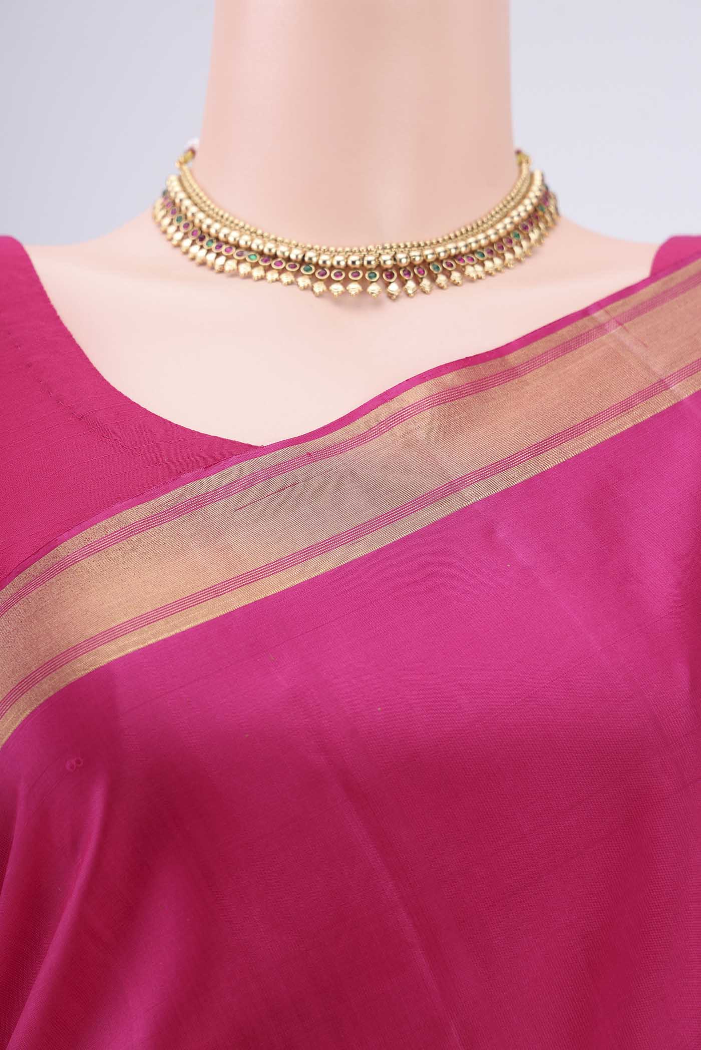 Border image of Rani Pink Baluchari Silk Saree with Zari Butta on the body and Zari Border. 