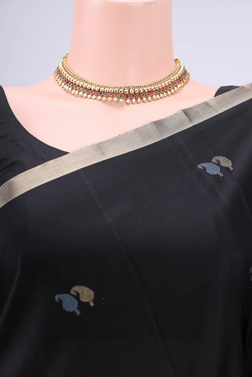 Border image of Black Baluchari Silk Saree with Zari And Thread Butta on the body and Zari Border. 
