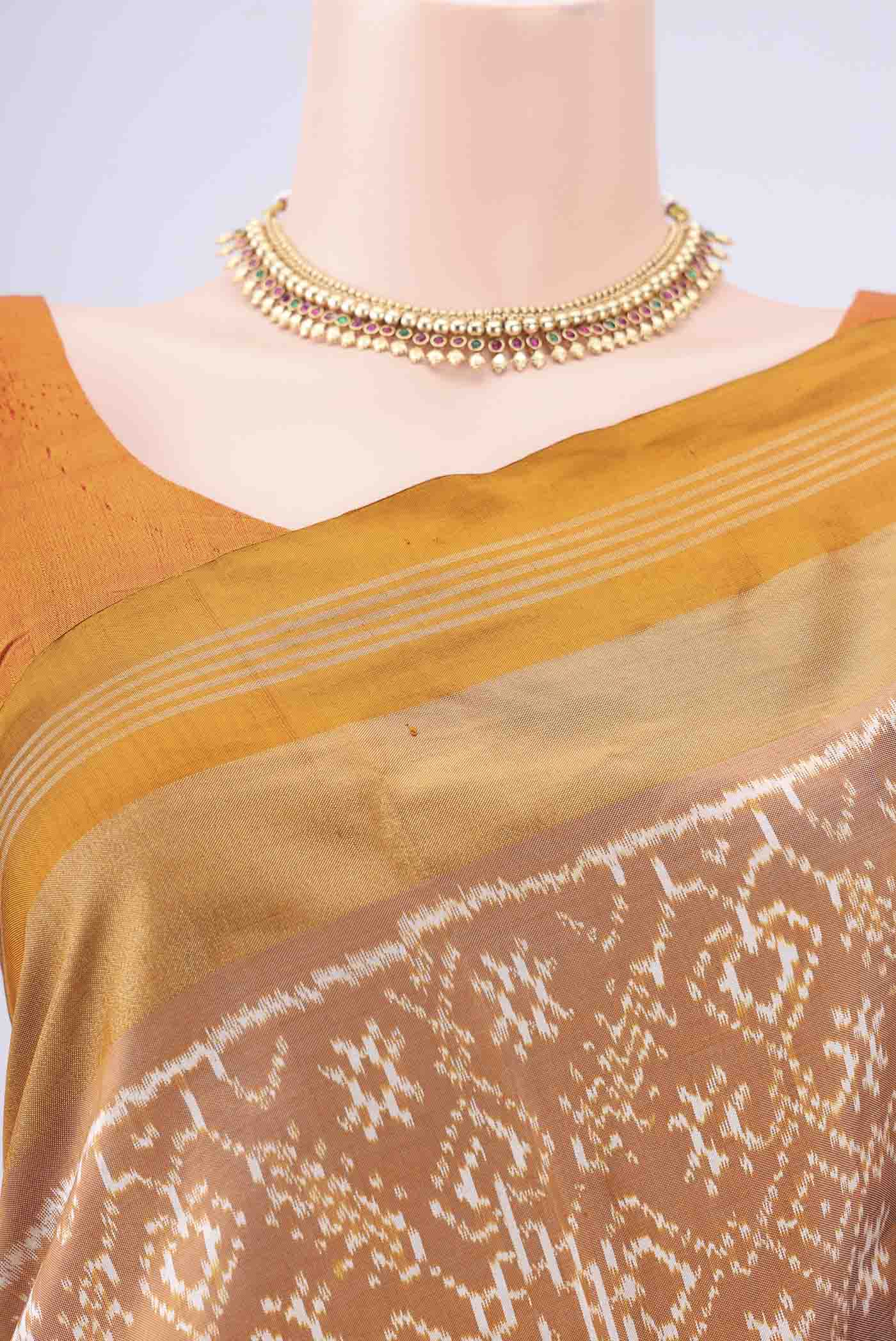 Border image of Sandal Pochampally Silk Saree with Checked design on the body and Zari Border. 