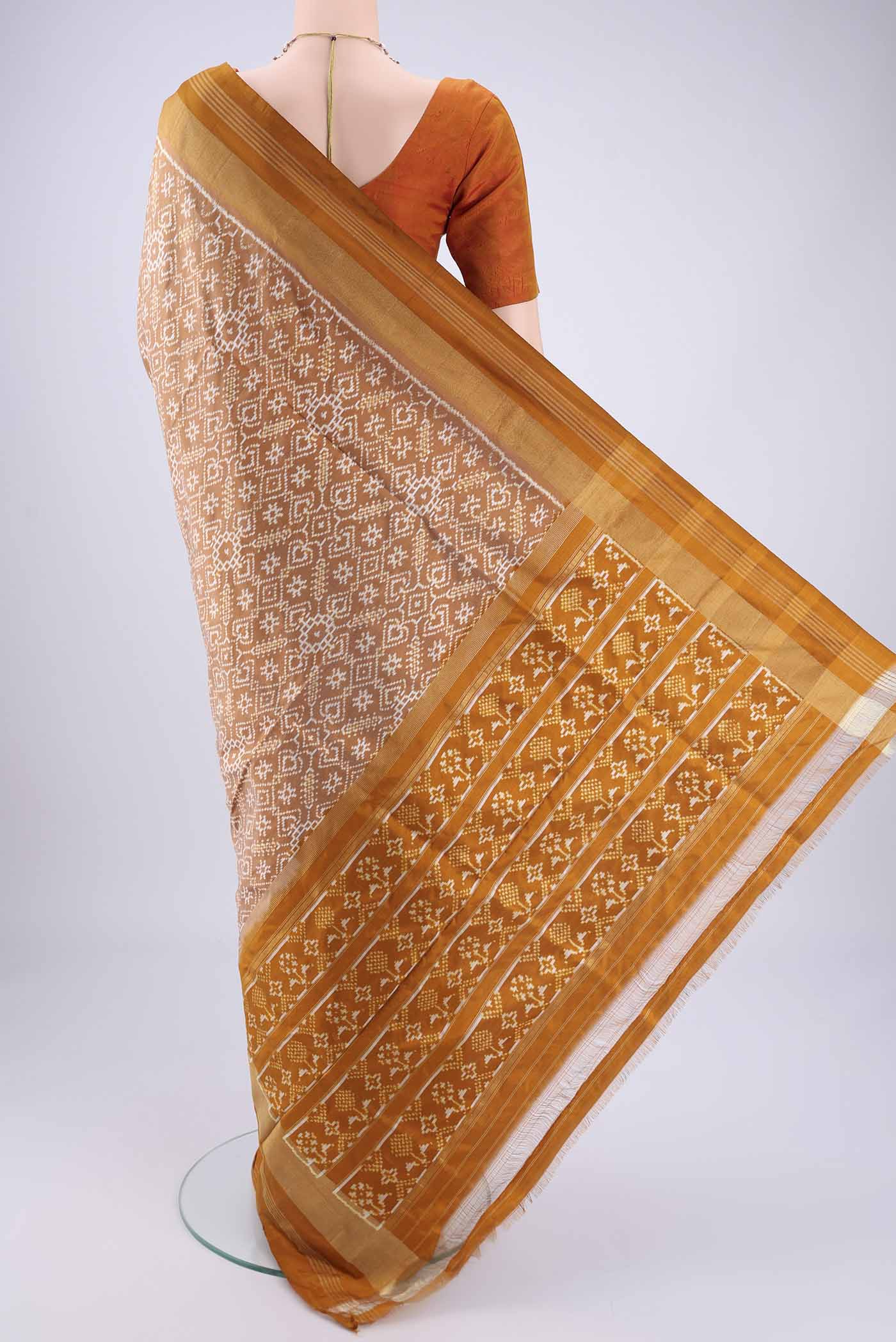 Flat view of Sandal Pochampally Silk Saree with Checked design on the body and Zari Border. 