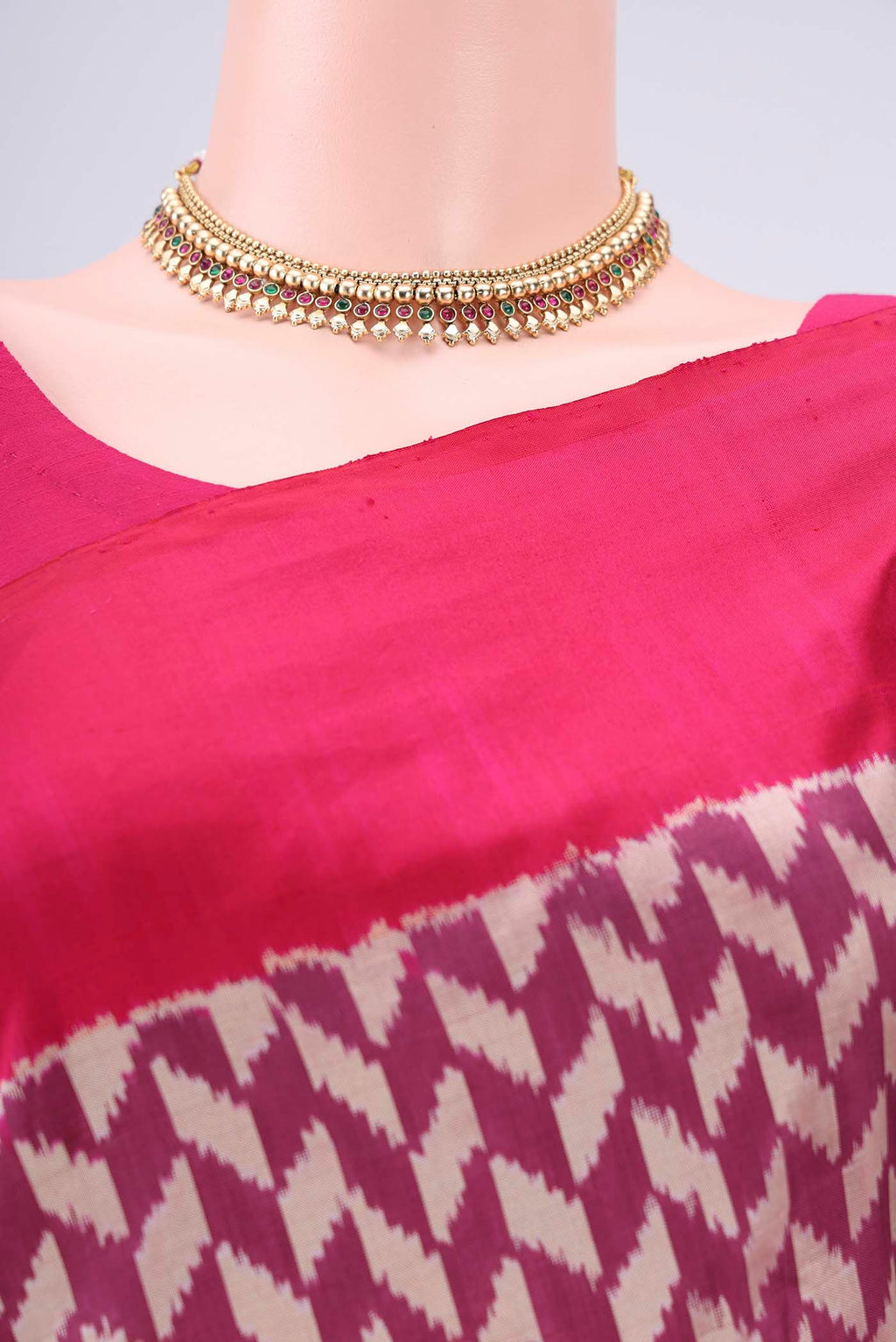 Border image of Magenta Pochampally Silk Saree with Ikat design on the body and Zari Border. 