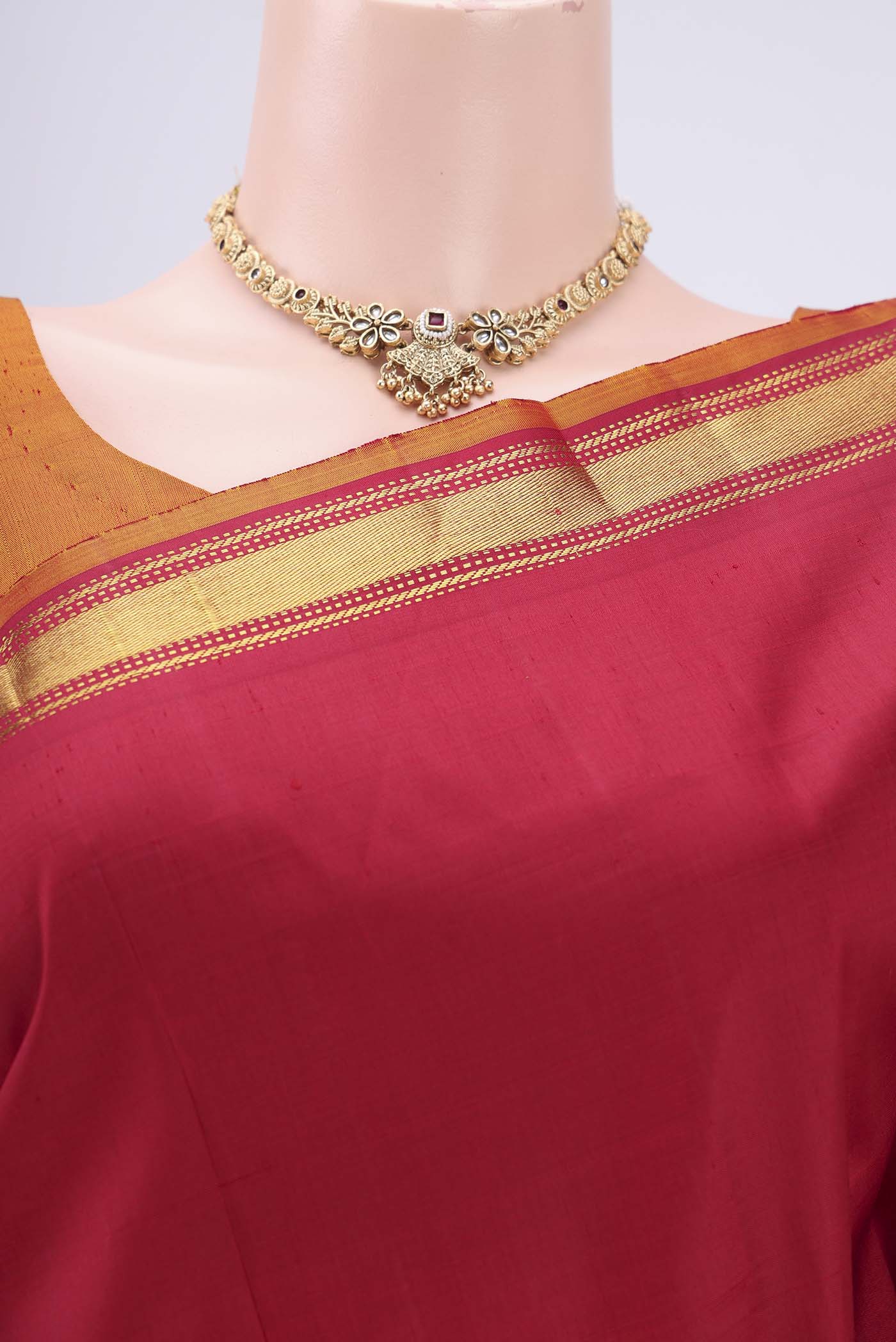 Border image of Red Kanjivaram Silk Saree with Zari Butta on the body and Zari Border. 