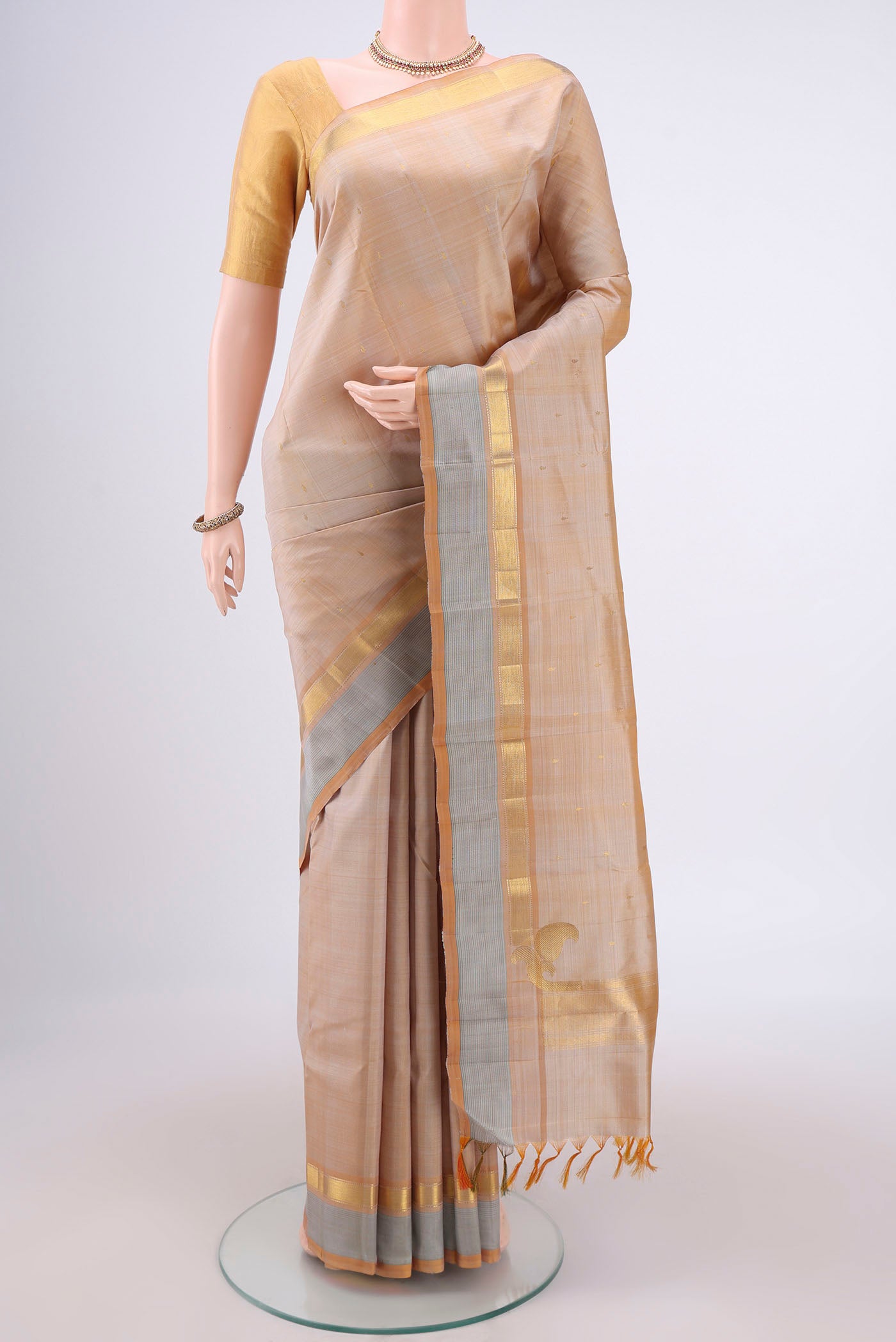 Dark Beige Coimbatore Silk Cotton Saree with Checked design on the body and Zari Border.  displayed on a mannequin