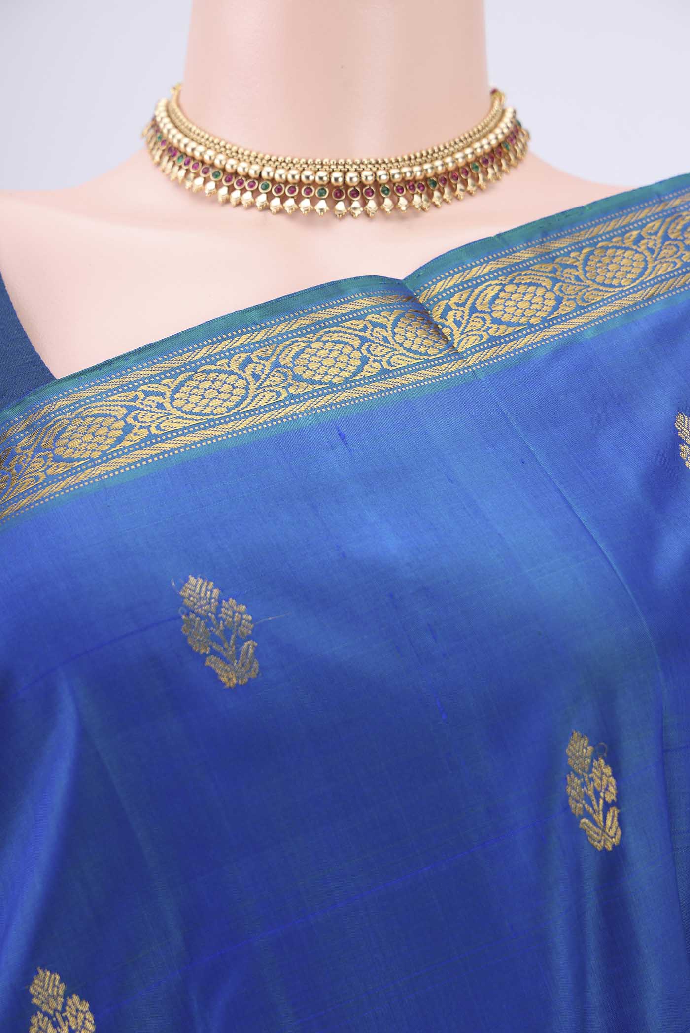 Border image of Turquoise Kanjivaram Silk Saree with Zari Butta on the body and Zari Border. 