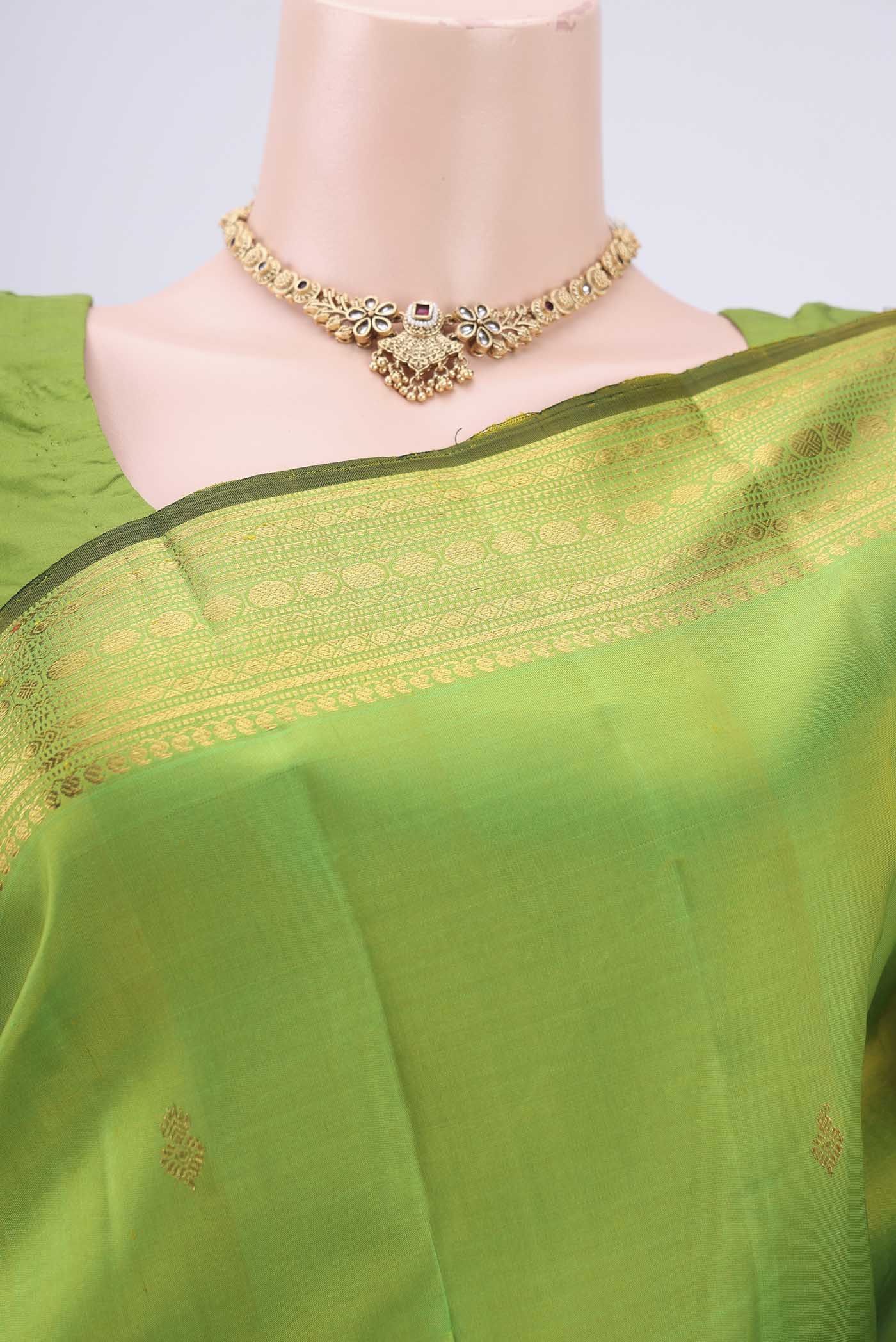 Border image of Parrot Green Kanjivaram Silk Saree with Zari Butta on the body and Zari Border. 