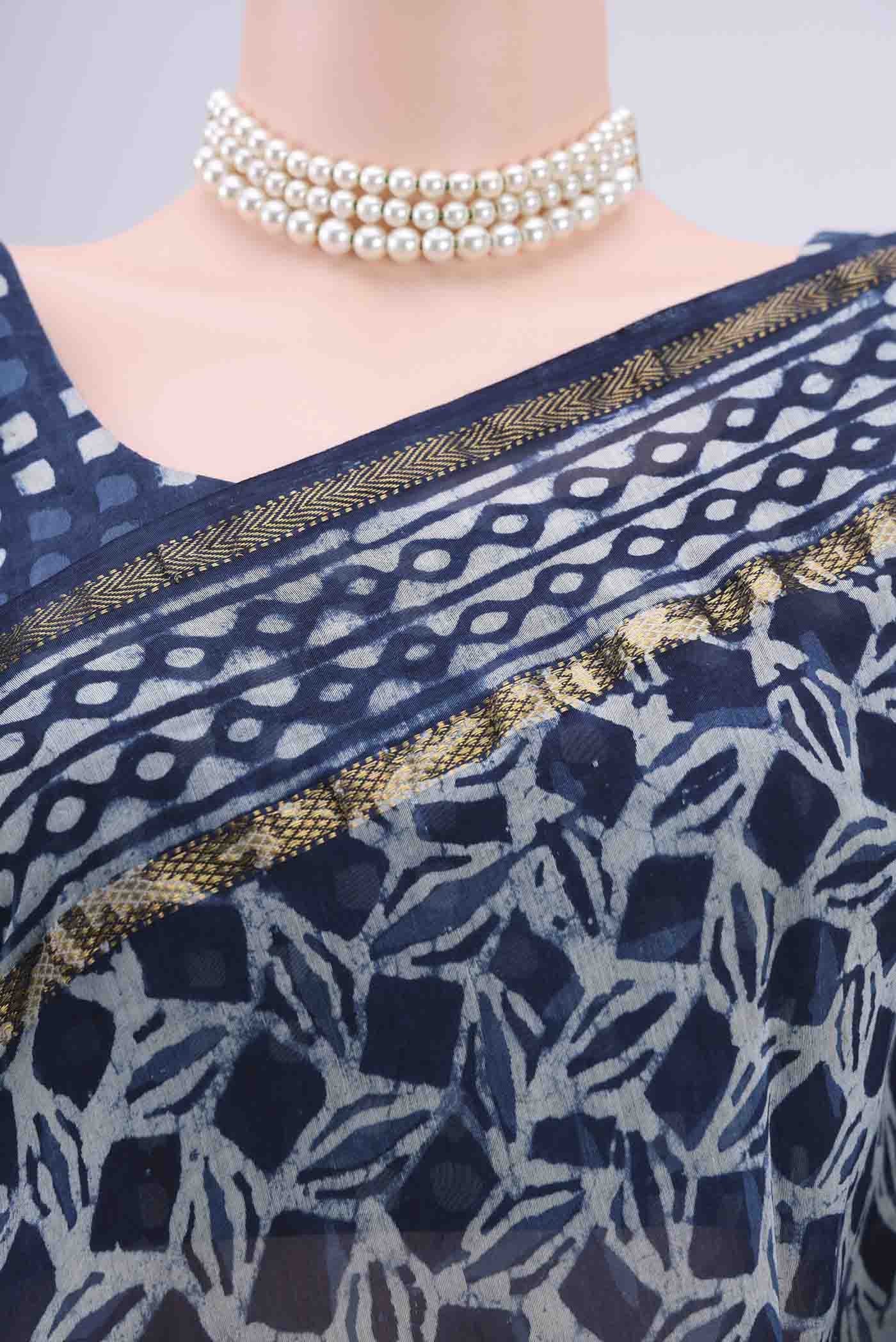 Border image of Indigo Maheshwari Silk Cotton Saree with Batik Print on the body and Zari Border. 