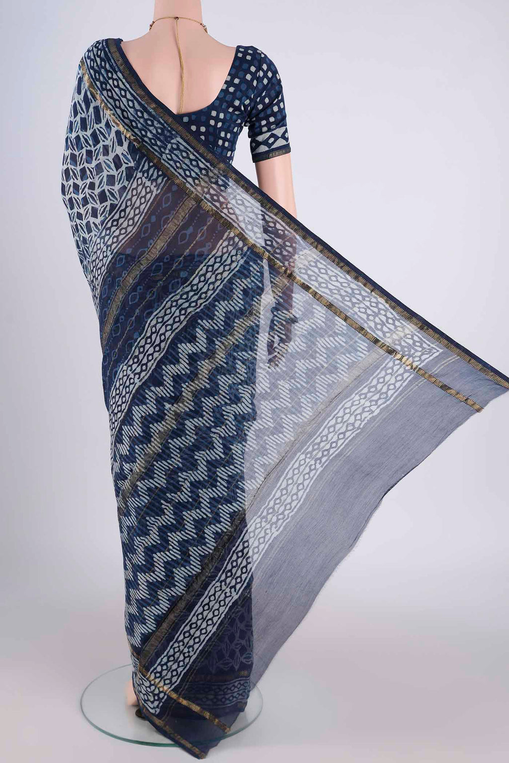 Flat view of Indigo Maheshwari Silk Cotton Saree with Batik Print on the body and Zari Border. 