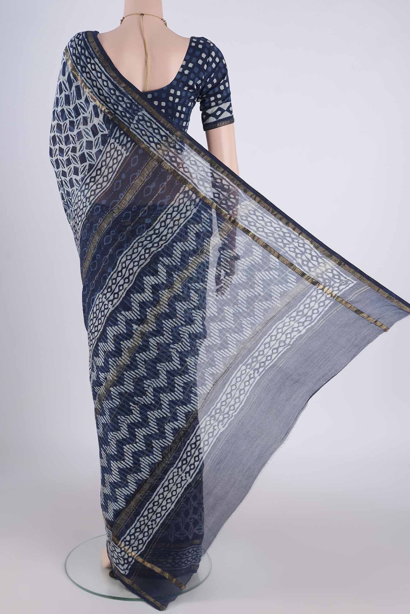 Flat view of Indigo Maheshwari Silk Cotton Saree with Batik Print on the body and Zari Border. 