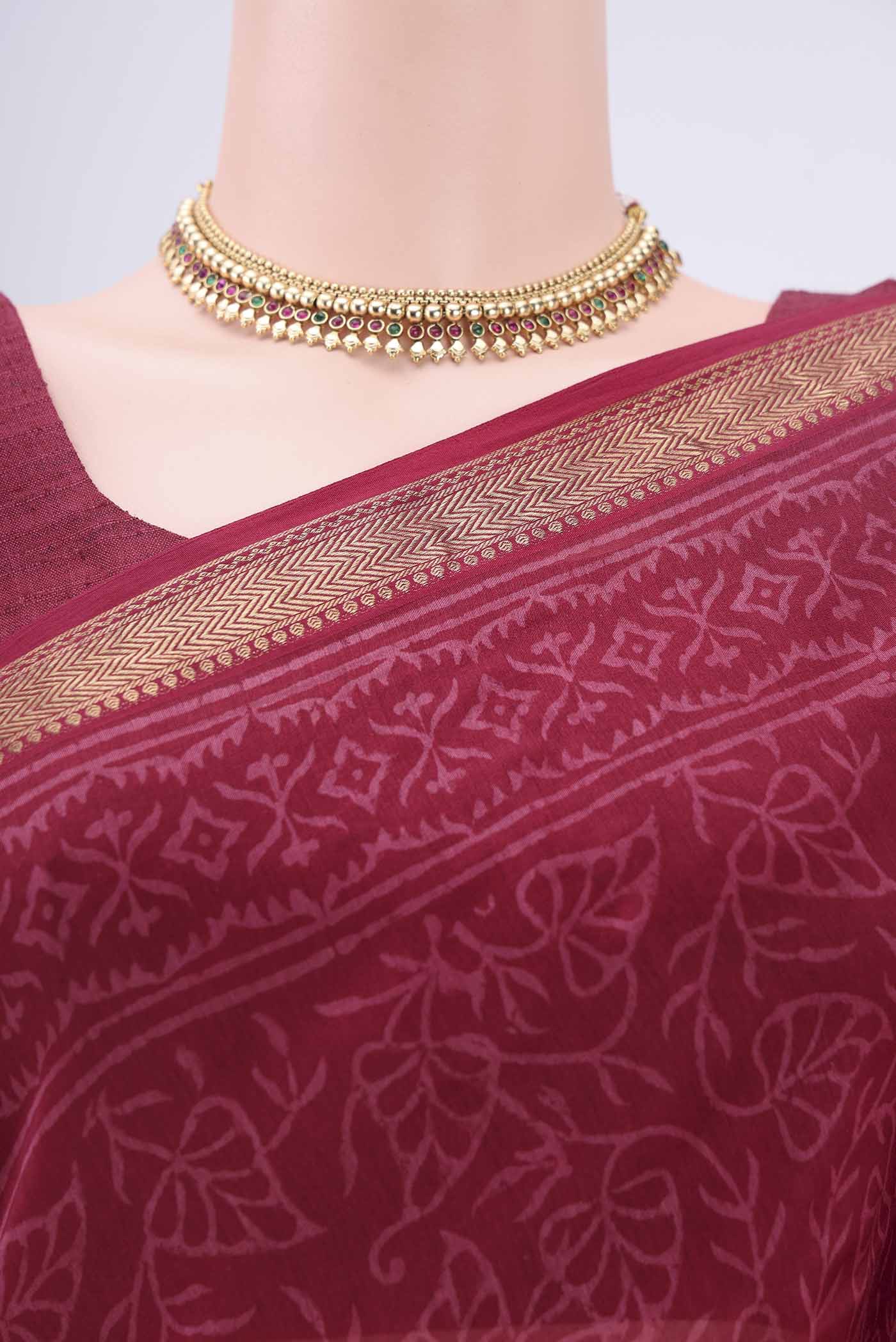 Border image of Maroon Maheshwari Silk Cotton Saree with Printed design on the body and Zari Border. 