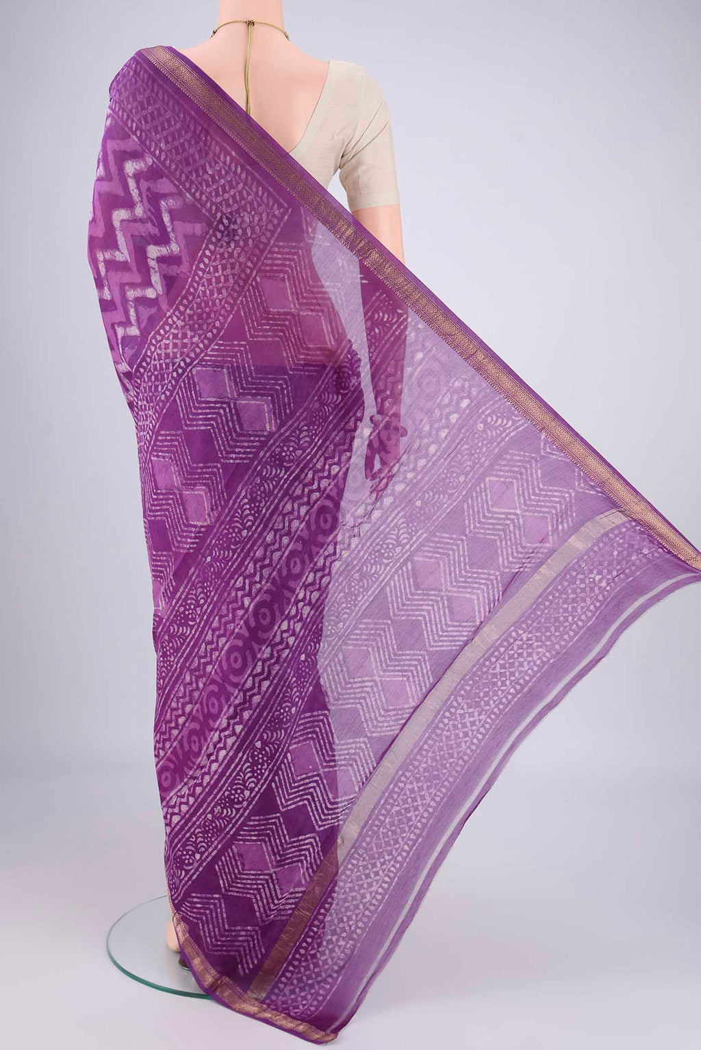 Flat view of Magenta Maheshwari Silk Cotton Saree with Batik Print on the body and Zari Border. 