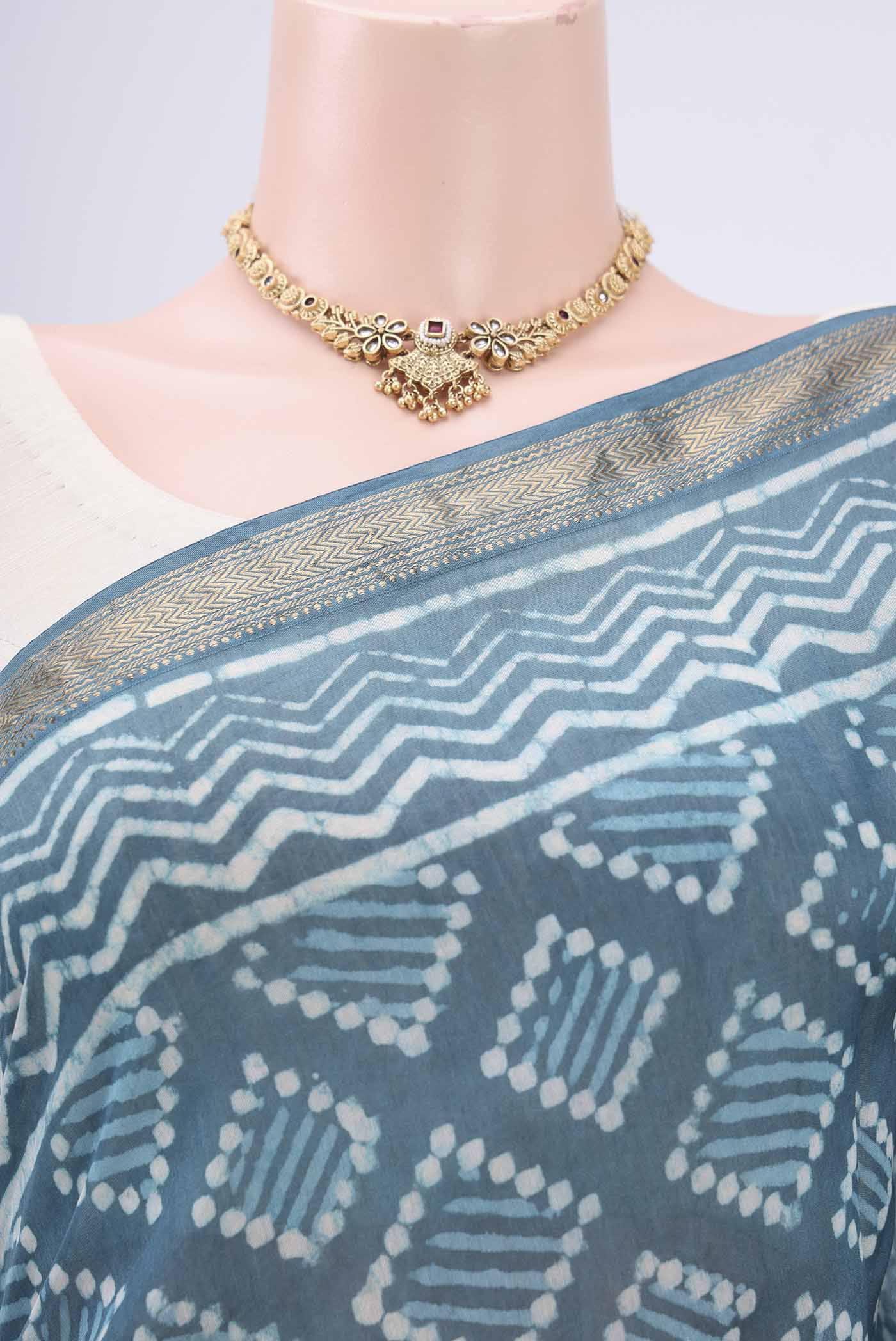 Border image of Maya Blue Maheshwari Silk Cotton Saree with Printed design on the body and Zari Border. 