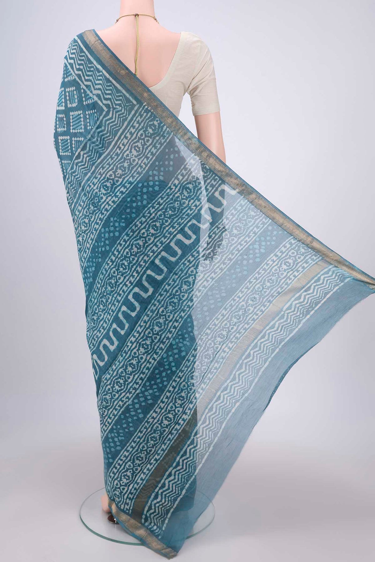 Flat view of Maya Blue Maheshwari Silk Cotton Saree with Printed design on the body and Zari Border. 