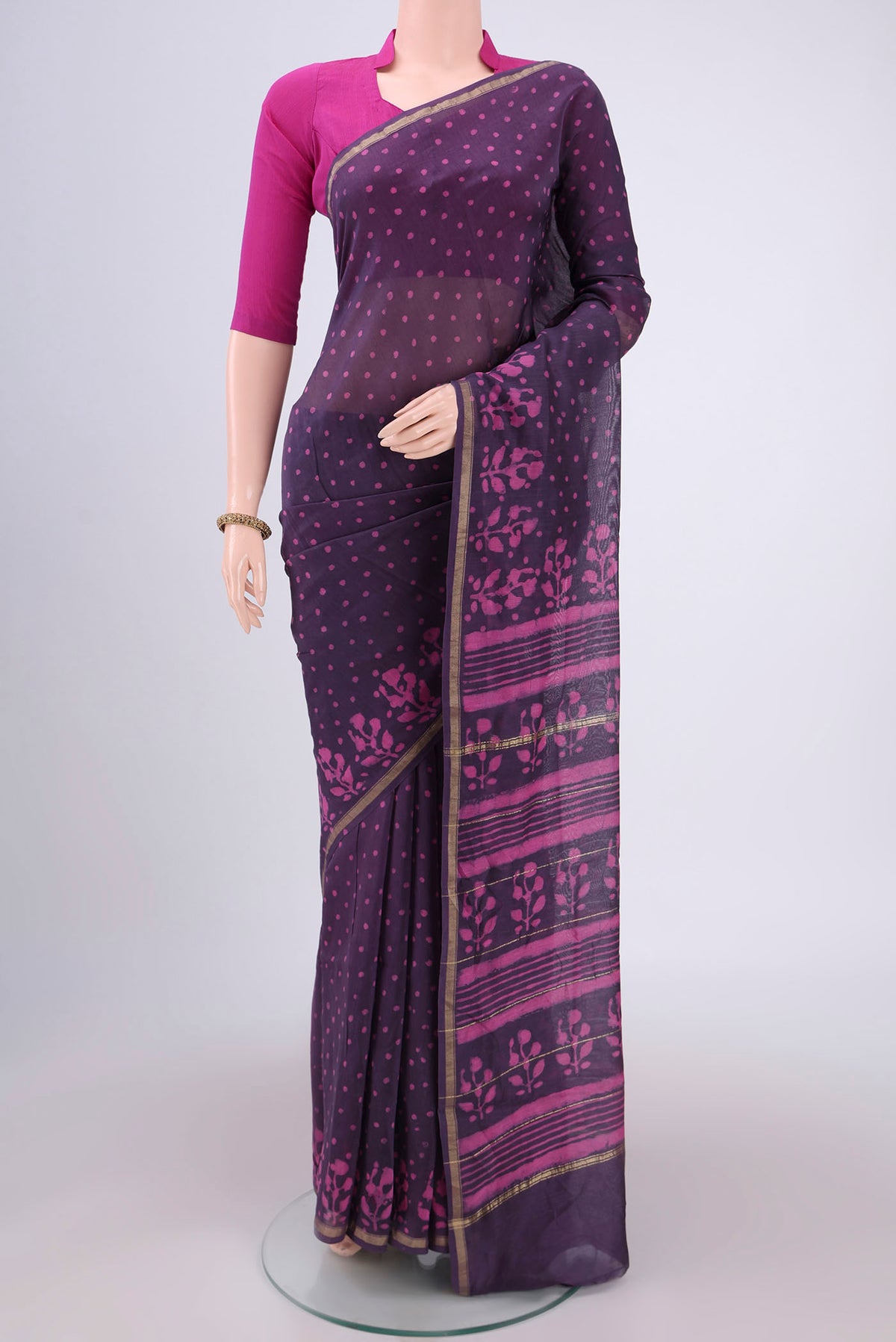 Purple Chanderi Silk Saree with Batik Print on the body and Zari Border.  displayed on a mannequin
