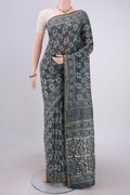 Davys Grey Maheshwari Silk Cotton Saree with Batik Print on the body and Zari Border.  displayed on a mannequin