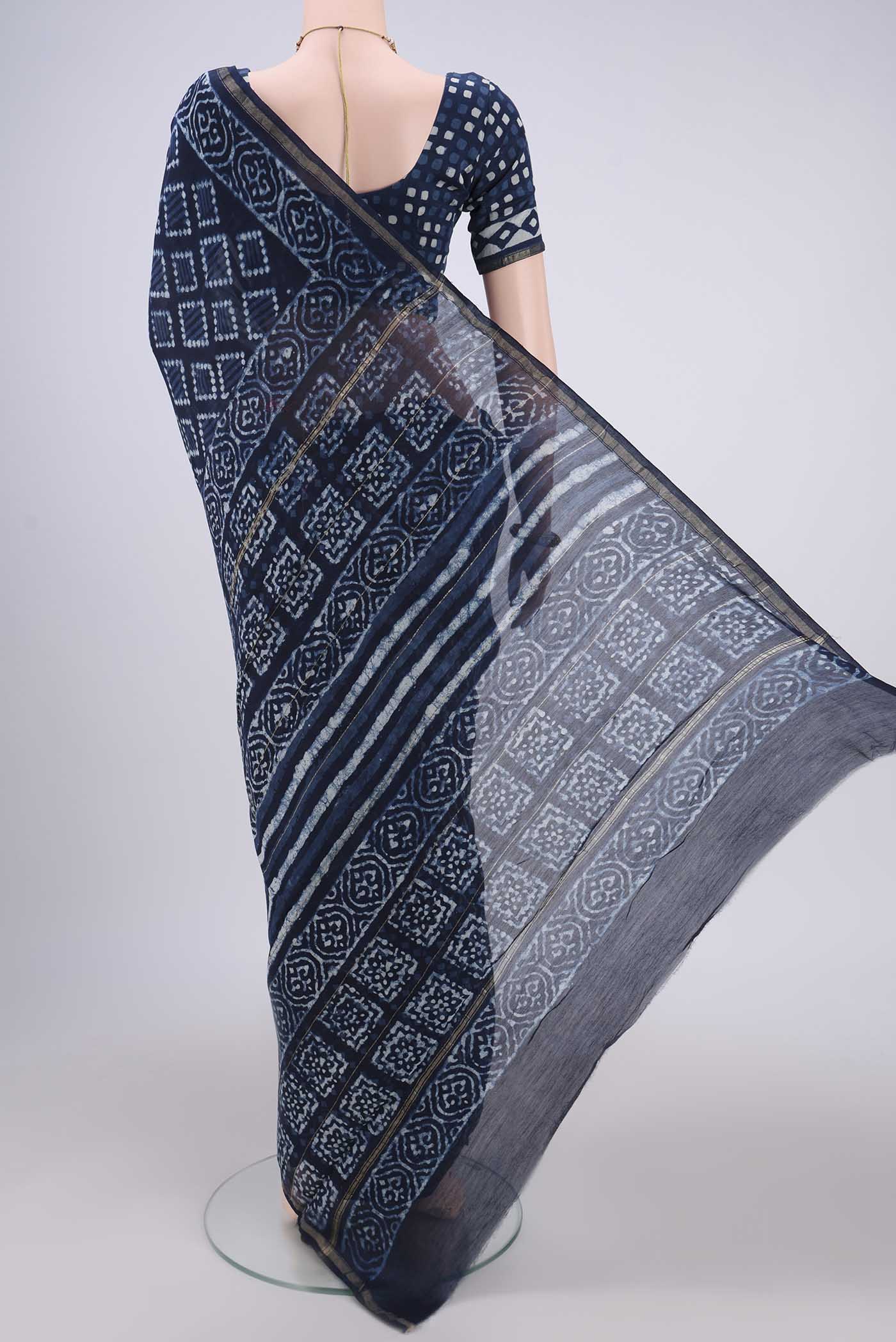 Flat view of Indigo Maheshwari Silk Cotton Saree with Batik Print on the body and Zari Border. 