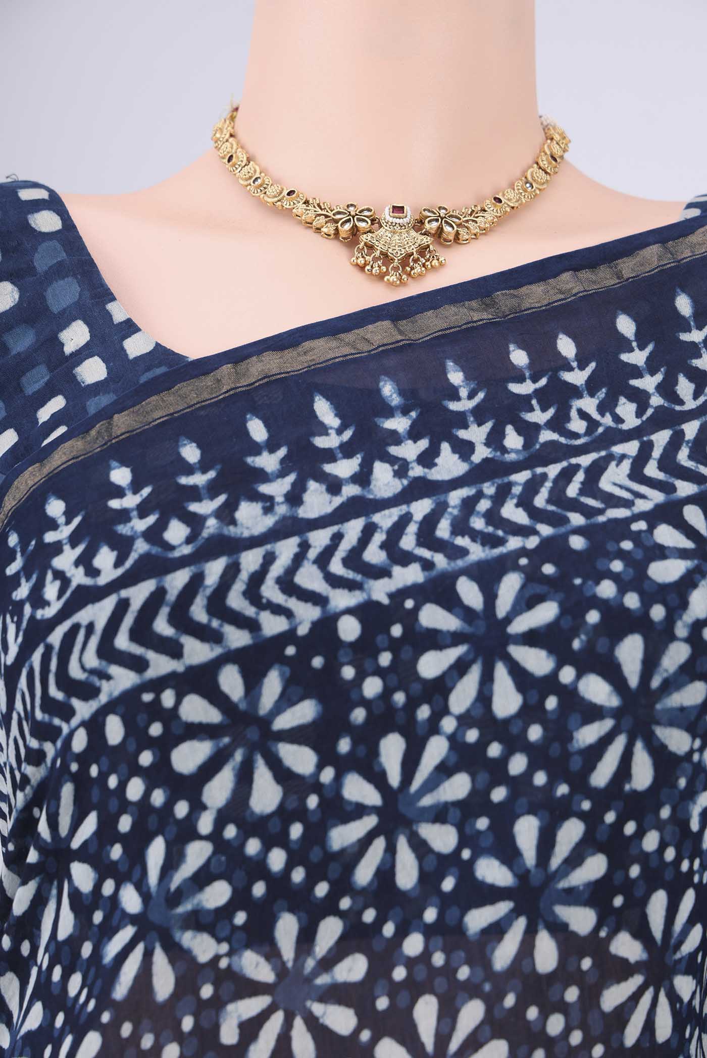 Border image of Indigo Maheshwari Silk Cotton Saree with Batik Print on the body and Zari Border. 