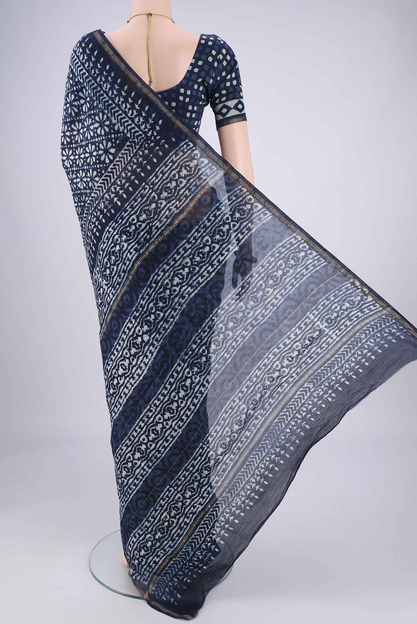 Flat view of Indigo Maheshwari Silk Cotton Saree with Batik Print on the body and Zari Border. 