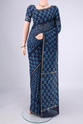 Indigo Maheshwari Silk Cotton Saree with Batik Print on the body and Zari Border.  displayed on a mannequin