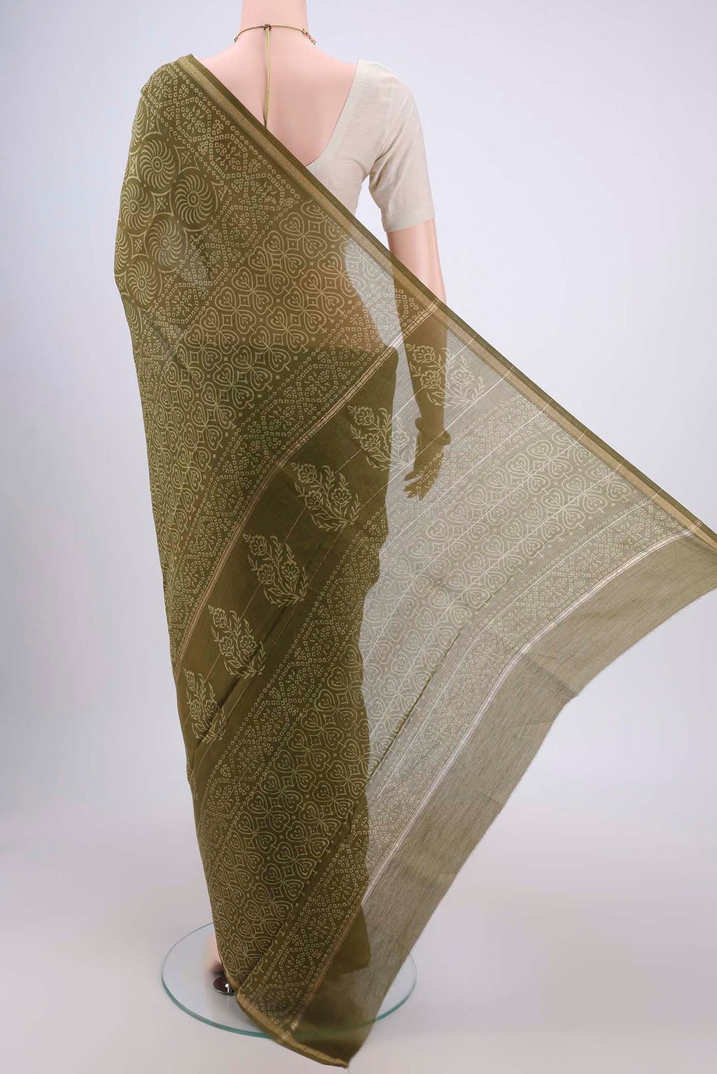 Flat view of Olive Green Chanderi Silk Saree with Printed design on the body and Zari Border. 