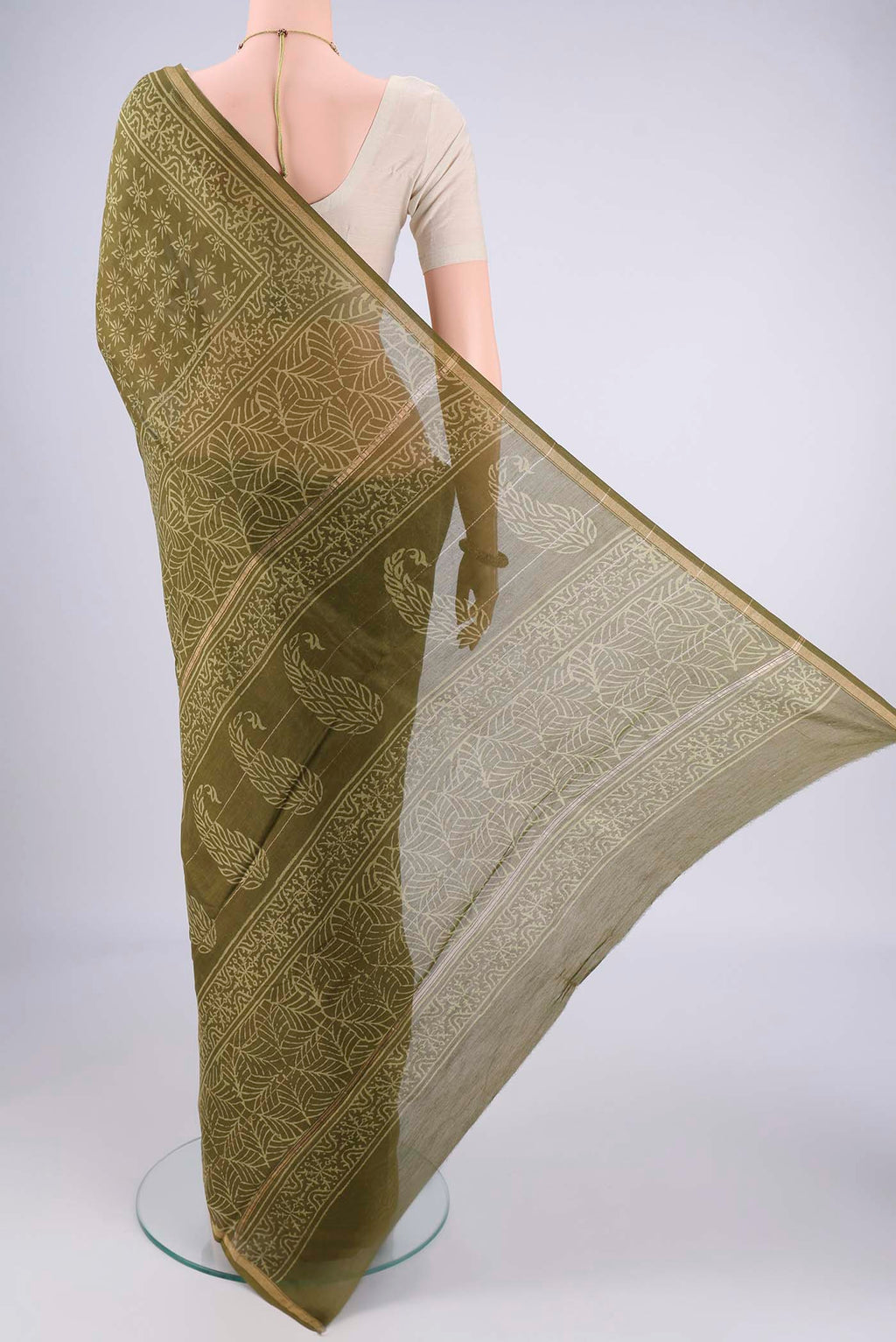 Flat view of Mehandi Green Maheshwari Silk Cotton Saree with Batik Print on the body and Zari Border. 