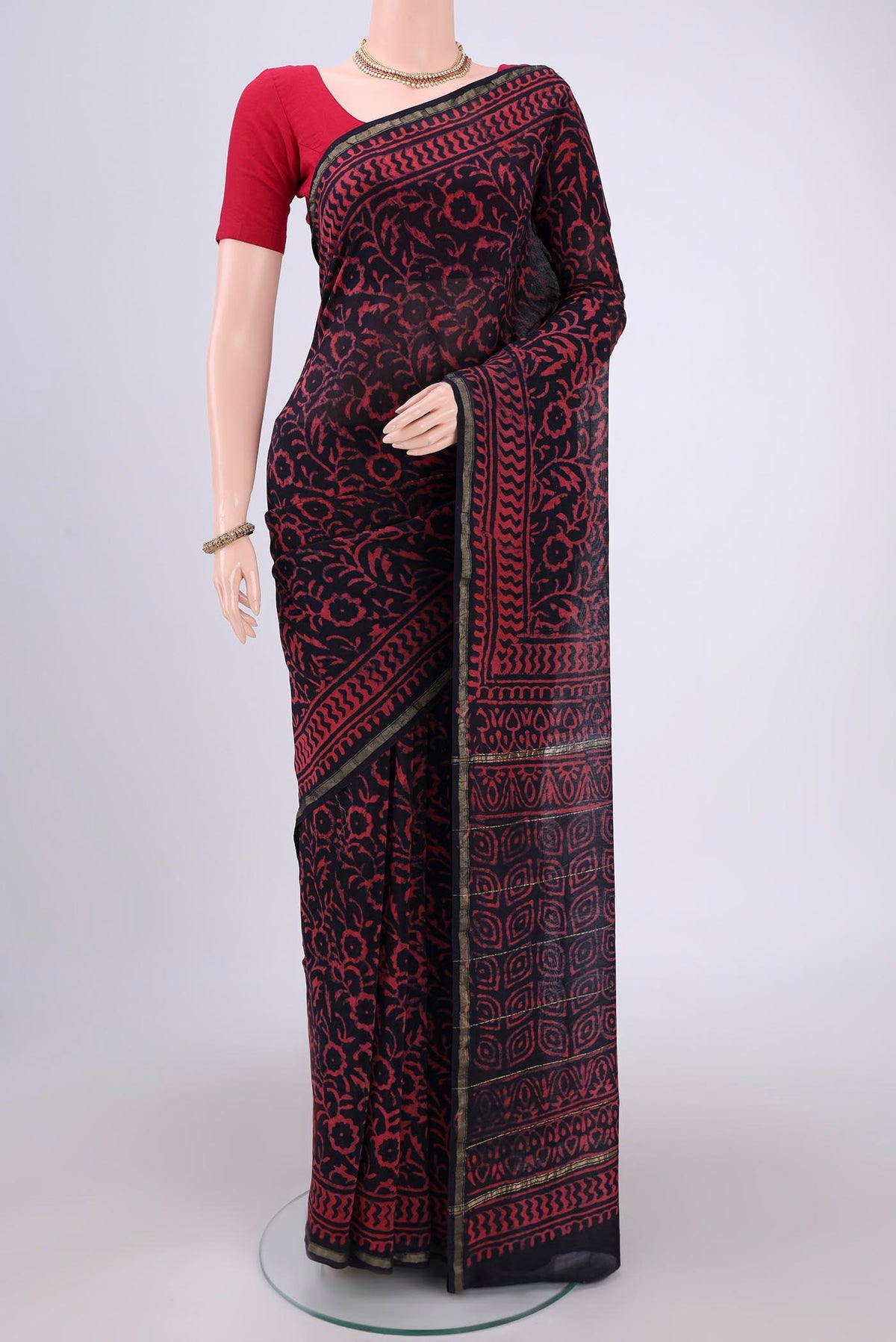 Navy Blue Chanderi Silk Saree with Batik Print on the body and Zari Border.  displayed on a mannequin
