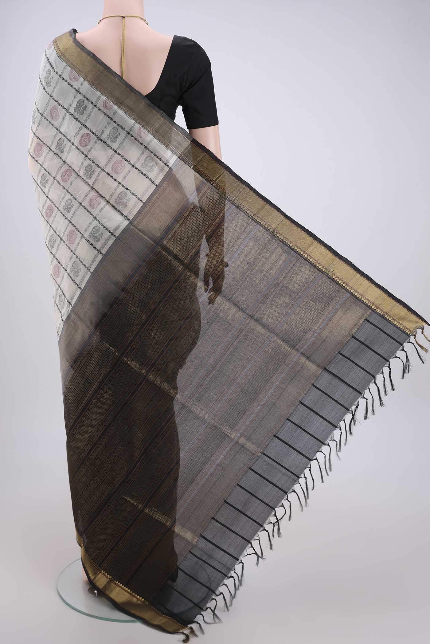 Flat view of Off White Coimbatore Silk Cotton Saree with Checked design on the body and Zari Border. 