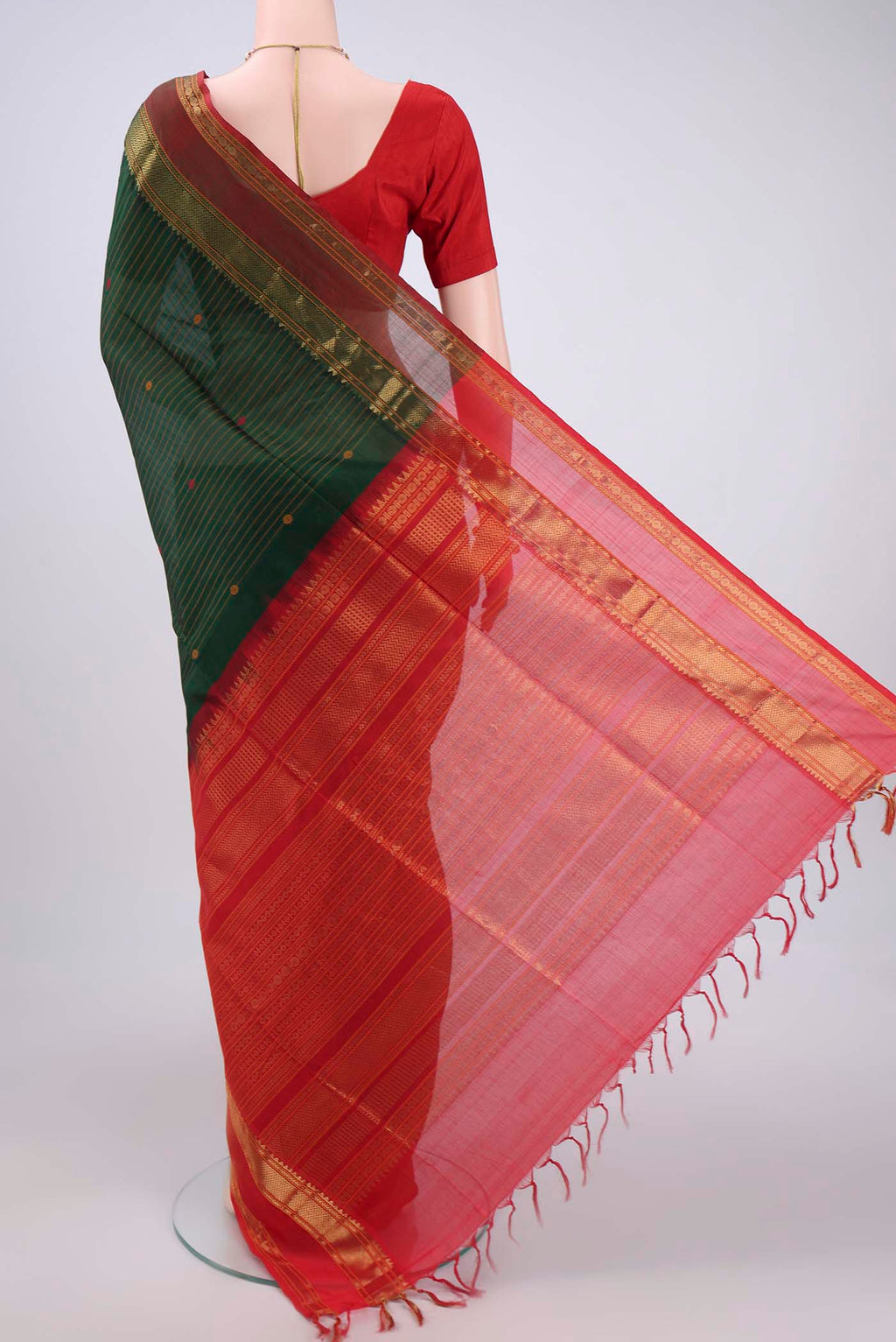 Flat view of Bottle Green Coimbatore Silk Cotton Saree with Stripes on the body and Zari And Thread Border. 