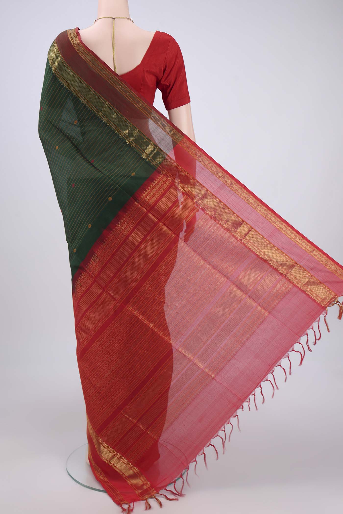 Flat view of Bottle Green Coimbatore Silk Cotton Saree with Stripes on the body and Zari And Thread Border. 