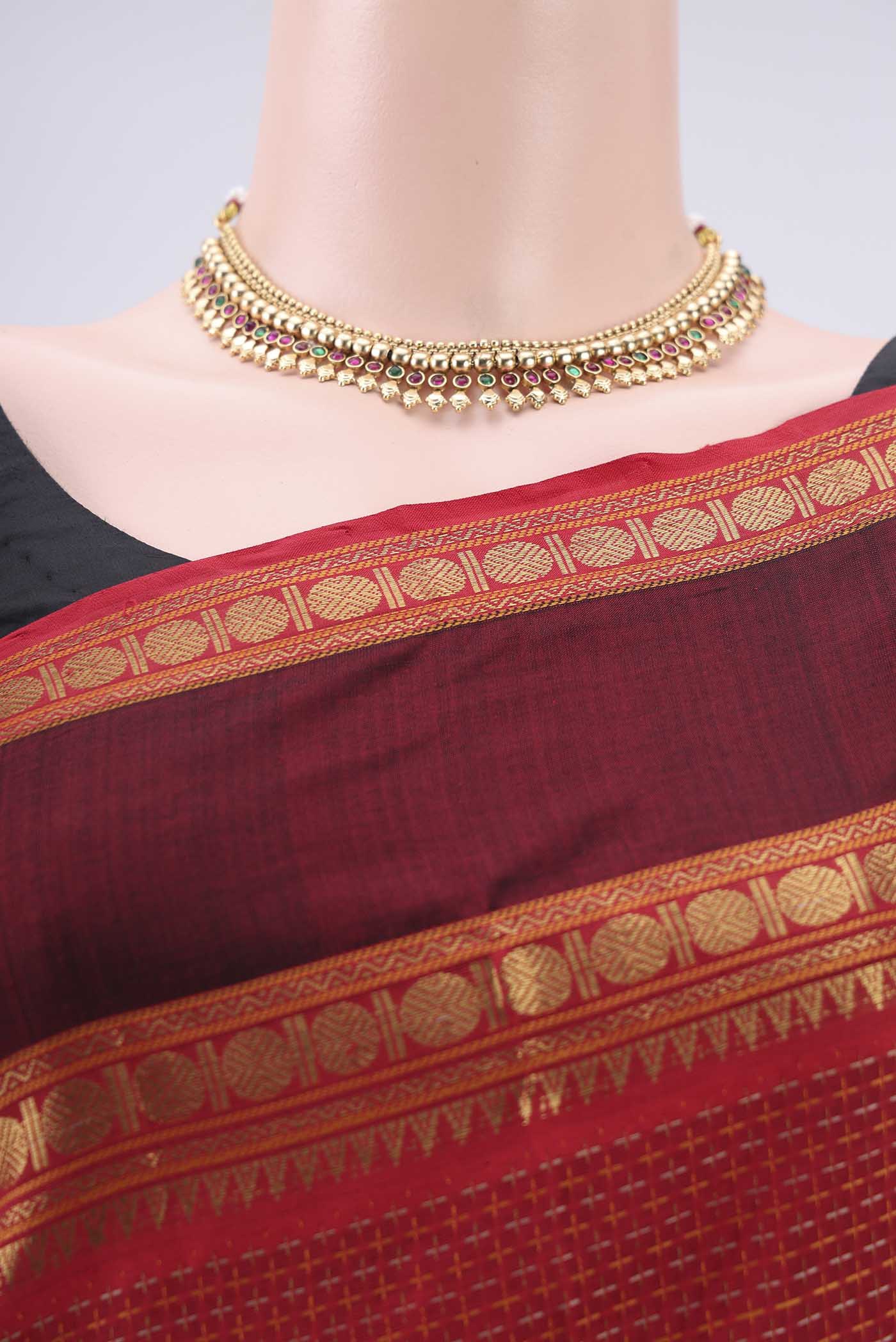 Border image of Red Coimbatore Silk Cotton Saree with Jacquard design on the body and Zari Border. 