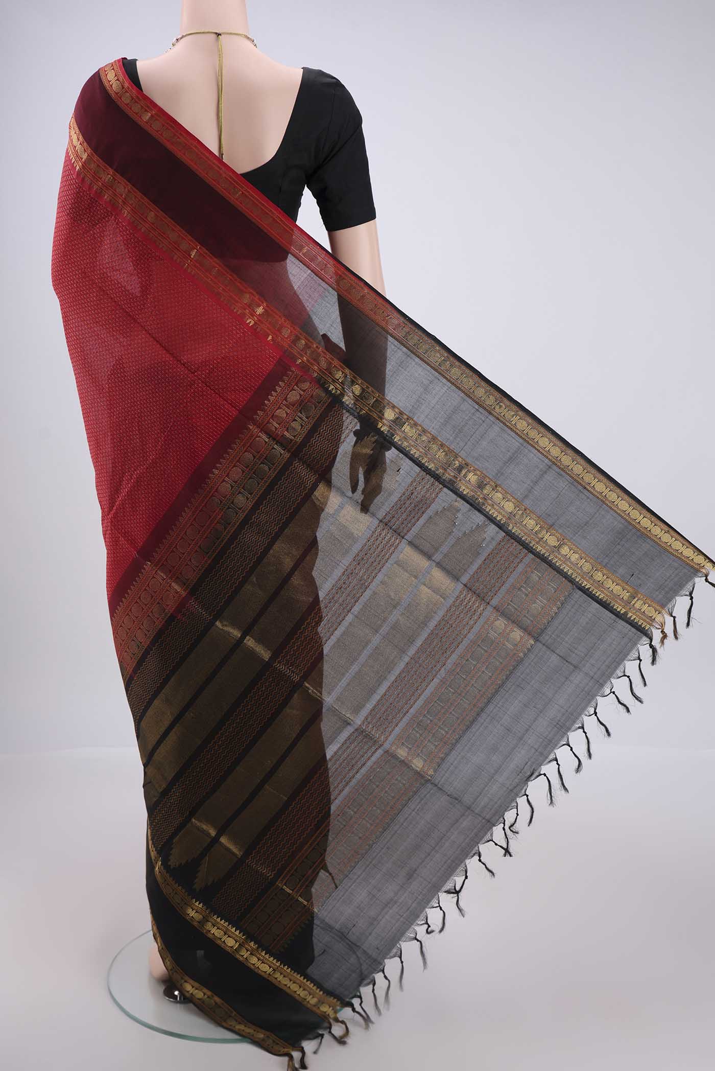 Flat view of Red Coimbatore Silk Cotton Saree with Jacquard design on the body and Zari Border. 