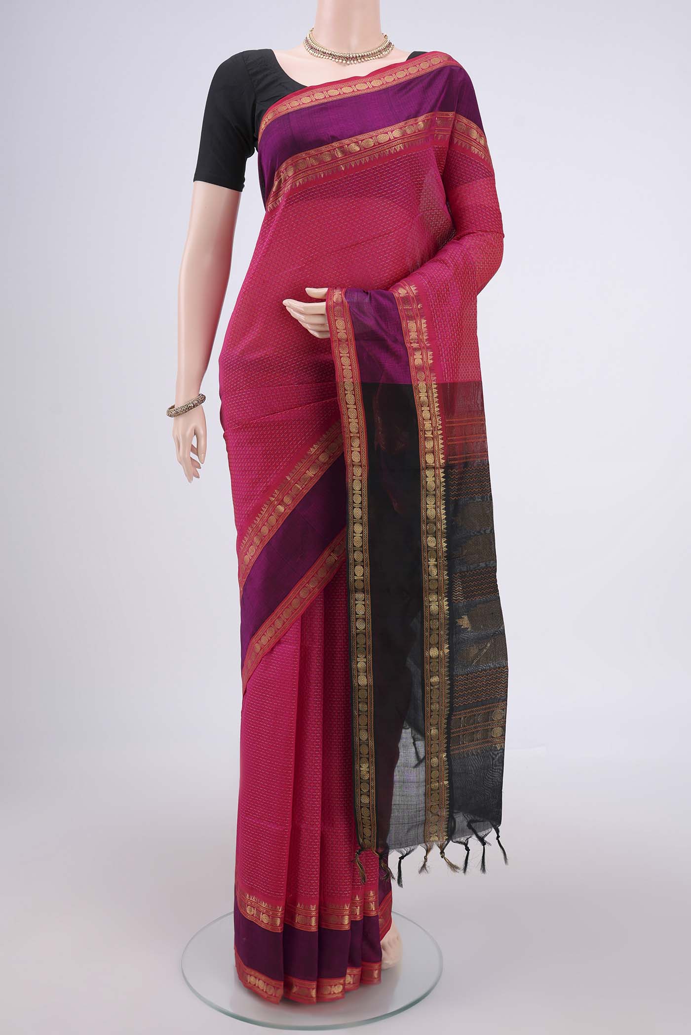Rani Pink Coimbatore Silk Cotton Saree with Jacquard design on the body and Zari Border.  displayed on a mannequin