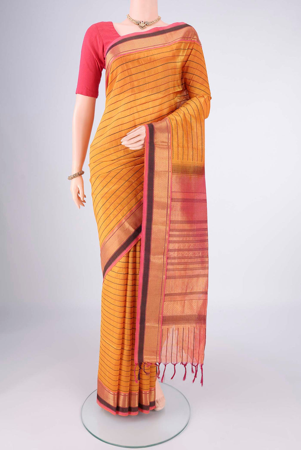 Yellow Coimbatore Silk Cotton Saree with Veldhari on the body and Zari Border.  displayed on a mannequin