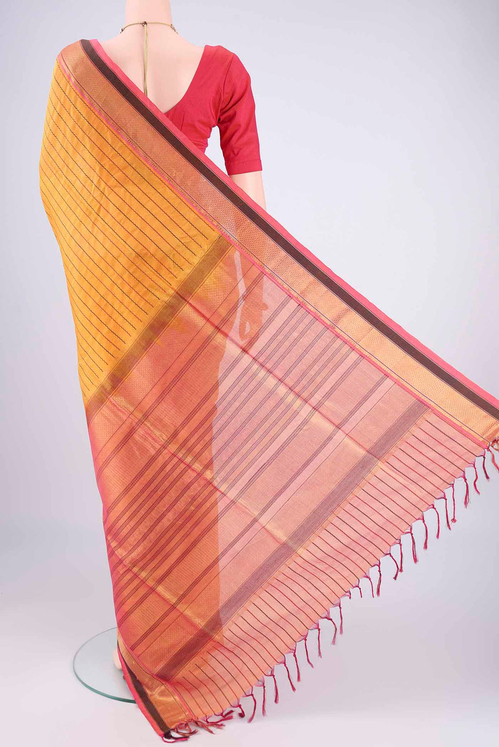 Flat view of Yellow Coimbatore Silk Cotton Saree with Veldhari on the body and Zari Border. 