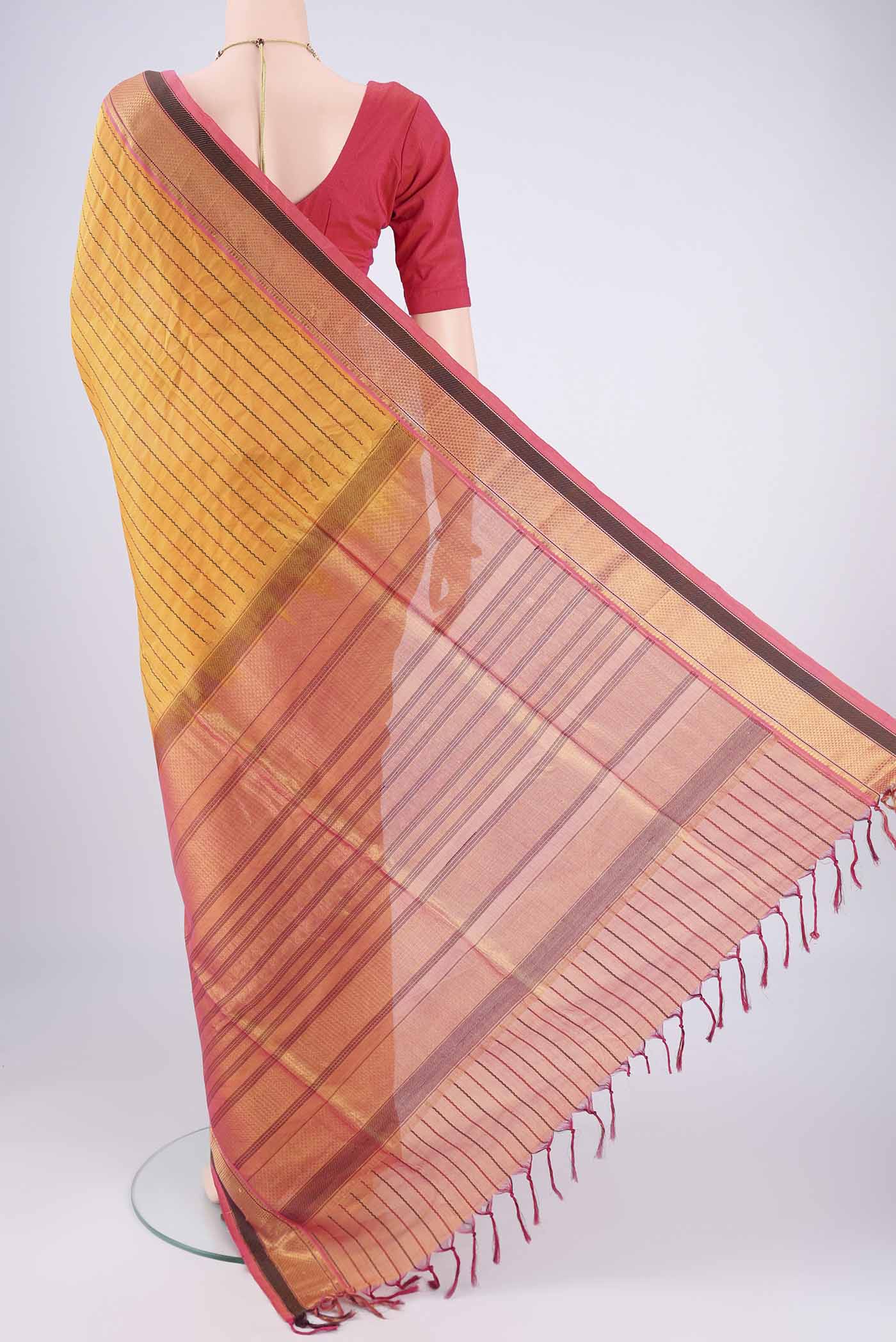 Flat view of Yellow Coimbatore Silk Cotton Saree with Veldhari on the body and Zari Border. 