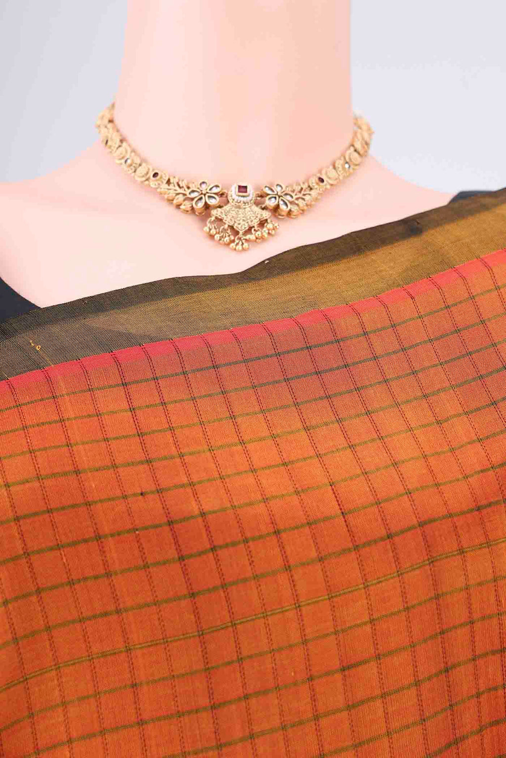Border image of Rust Coimbatore Silk Cotton Saree with Checked design on the body and Plain Border. 