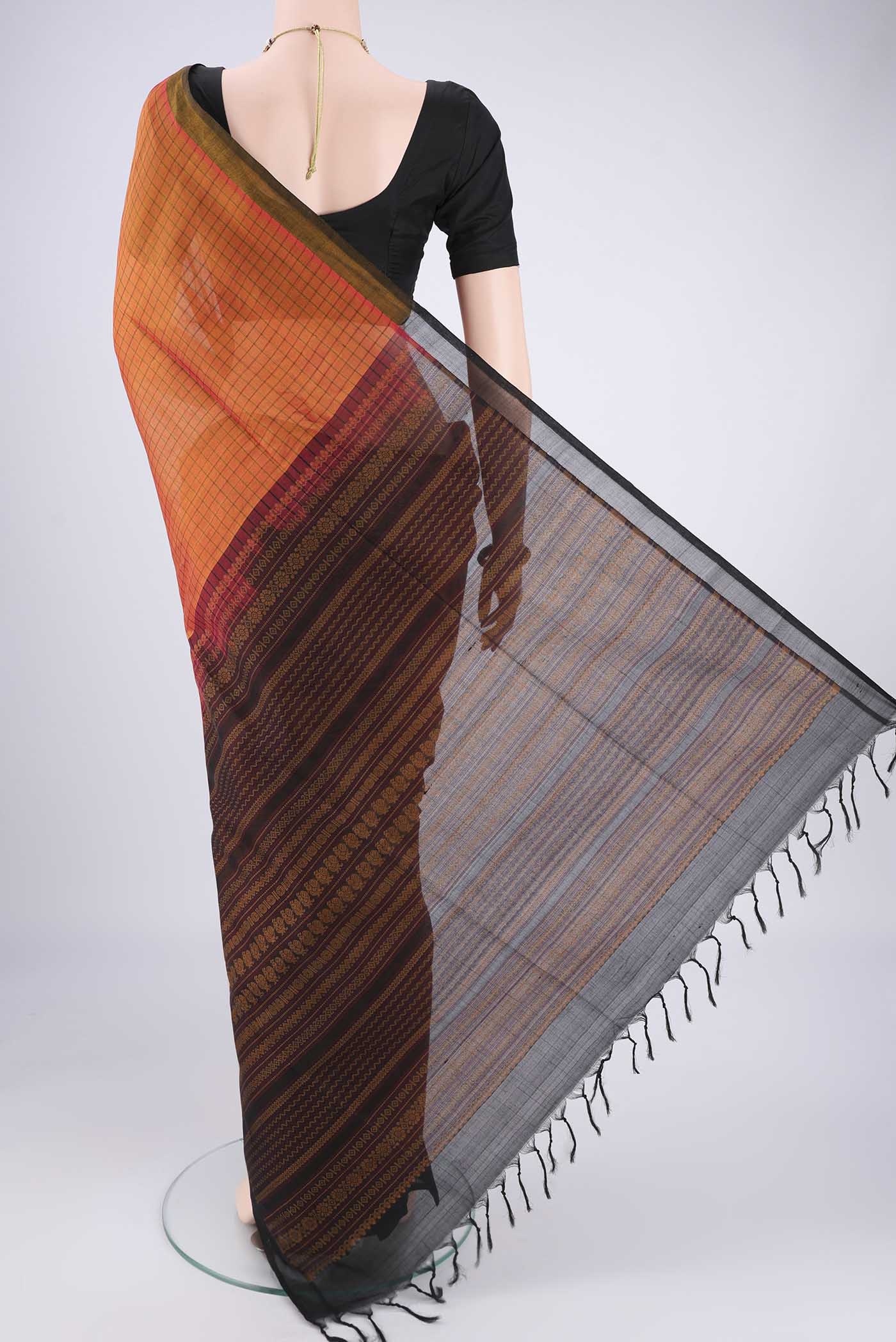 Flat view of Rust Coimbatore Silk Cotton Saree with Checked design on the body and Plain Border. 