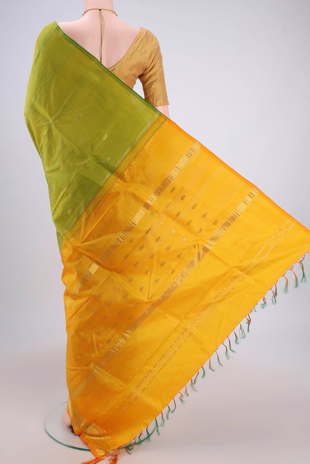 Flat view of Light Green Kanjivaram Silk Saree with Plain Body and One Side Border. 