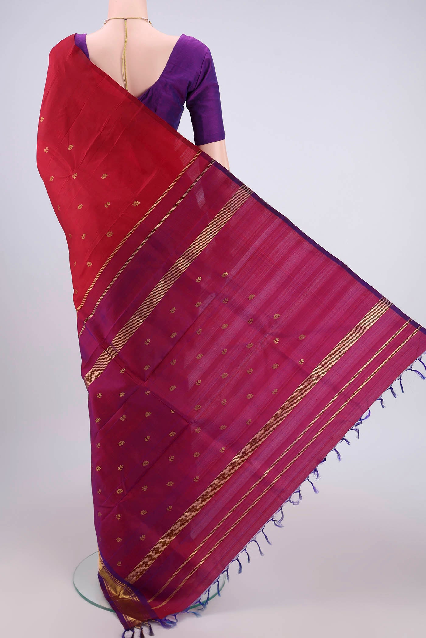Flat view of Maroon Kanjivaram Silk Saree with Plain Body and One Side Border. 