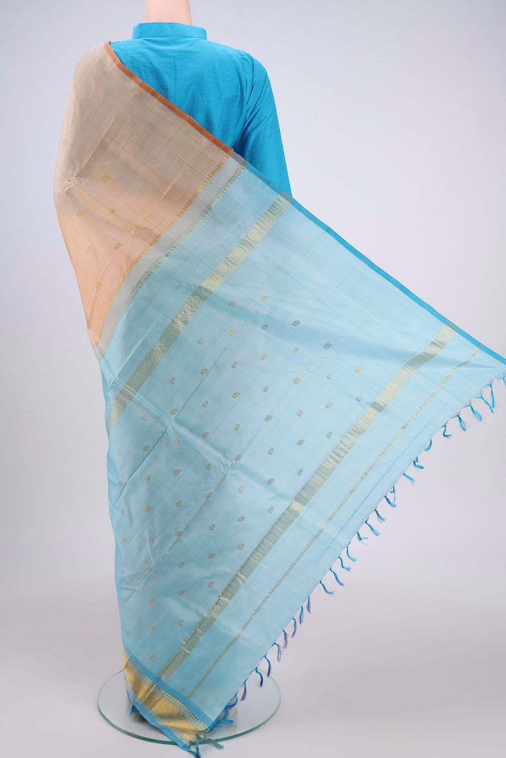 Flat view of Cream Kanjivaram Silk Saree with Zari Butta on the body and One Side Border. 