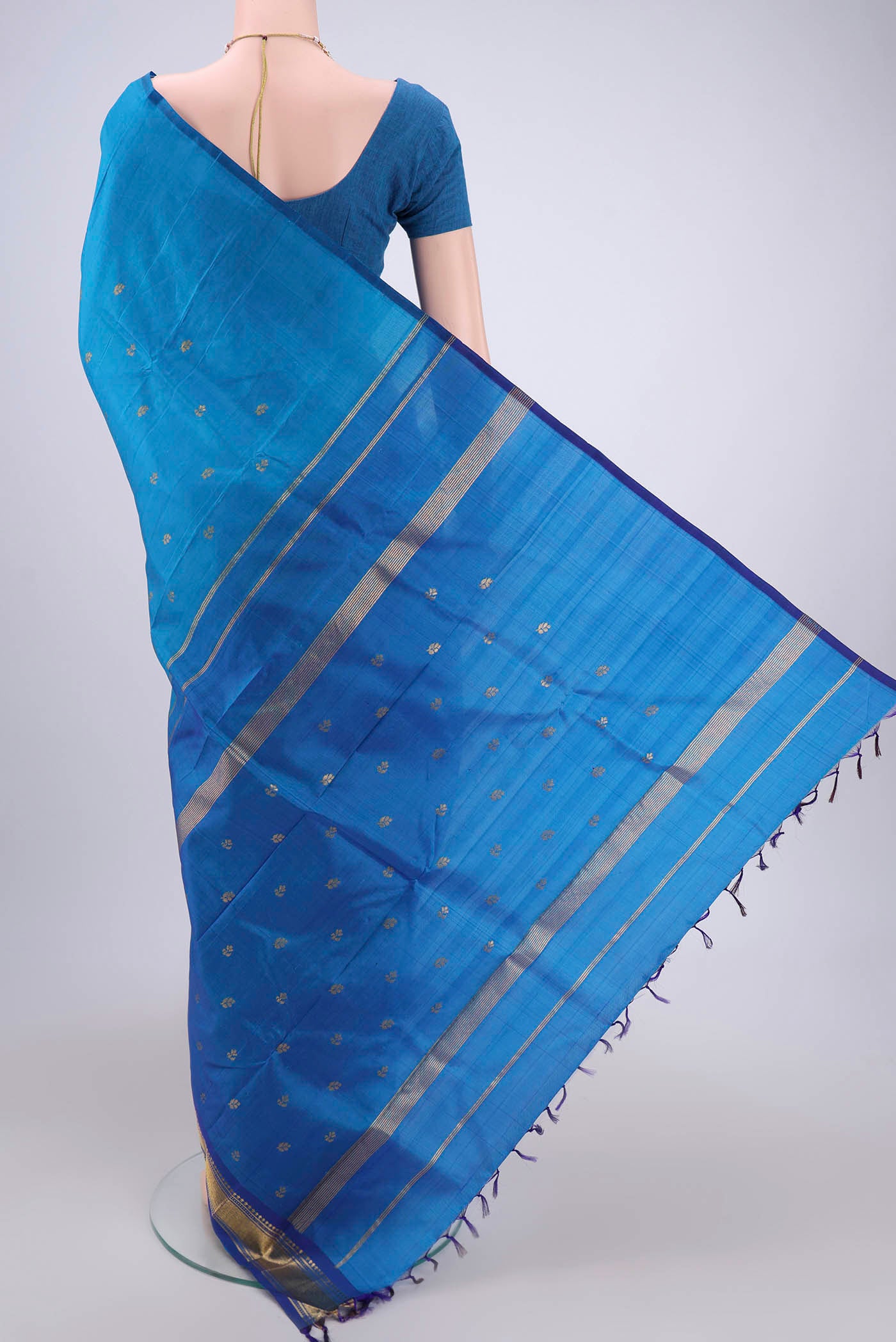 Flat view of Blue Kanjivaram Silk Saree with Zari Butta on the body and One Side Border. 