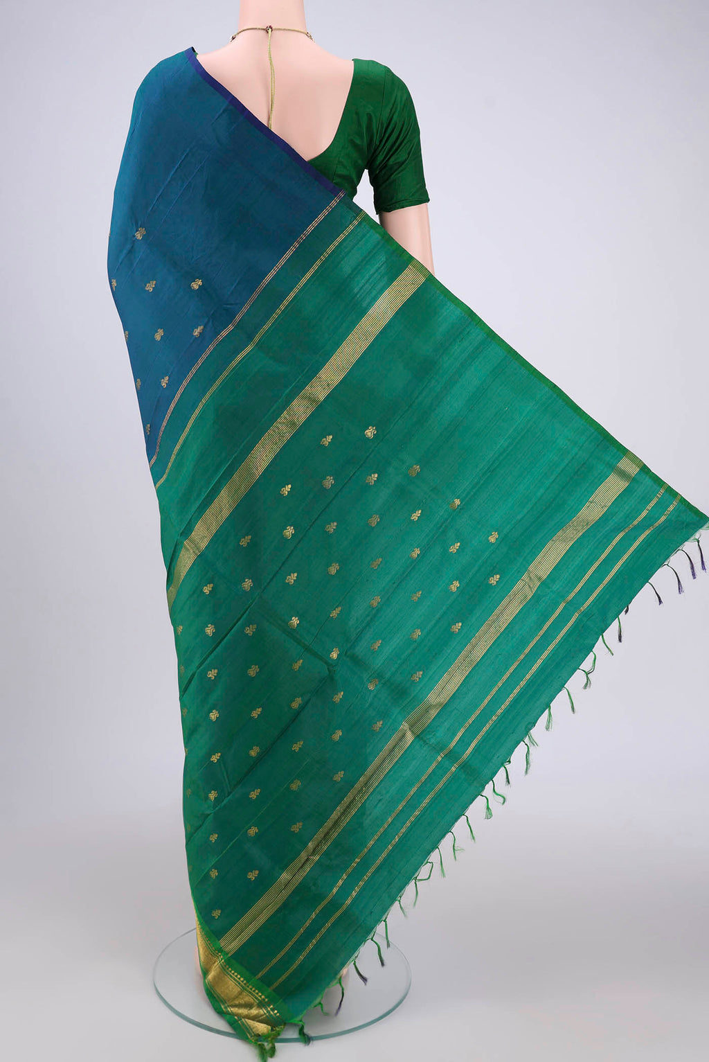 Flat view of Peacock Blue Kanjivaram Silk Saree with Zari Butta on the body and One Side Border. 