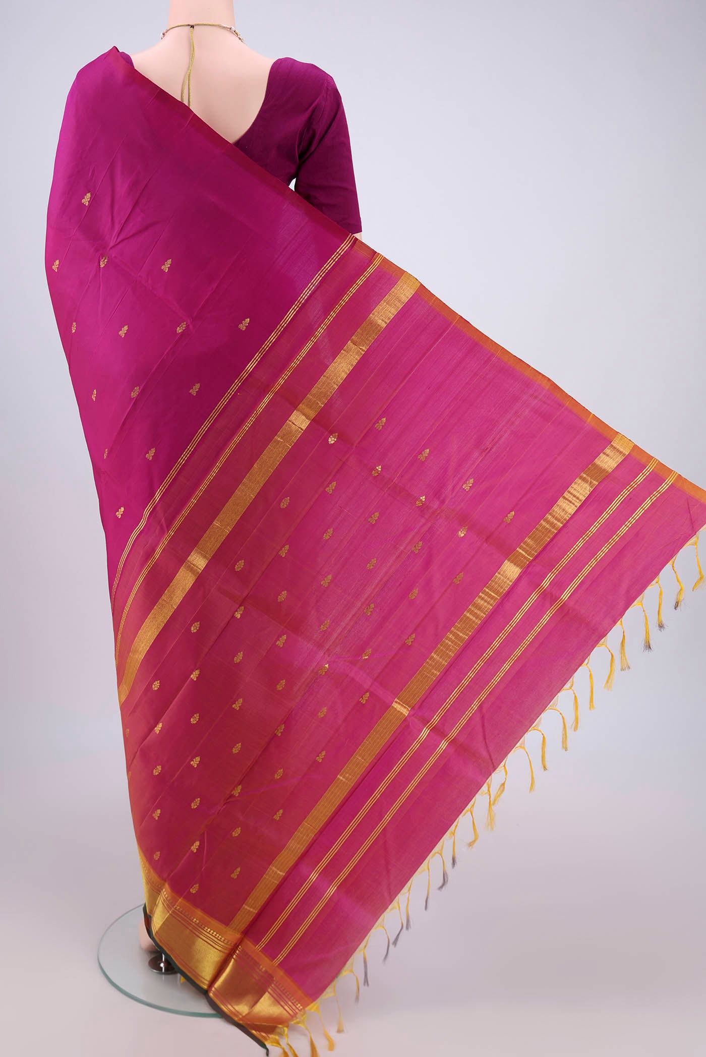 Flat view of Magenta Kanjivaram Silk Saree with Plain Body and One Side Border. 