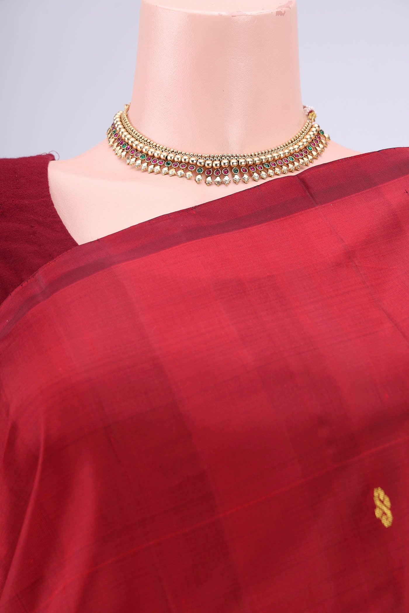 Border image of Maroon Kanjivaram Silk Saree with Zari Butta on the body and One Side Border. 