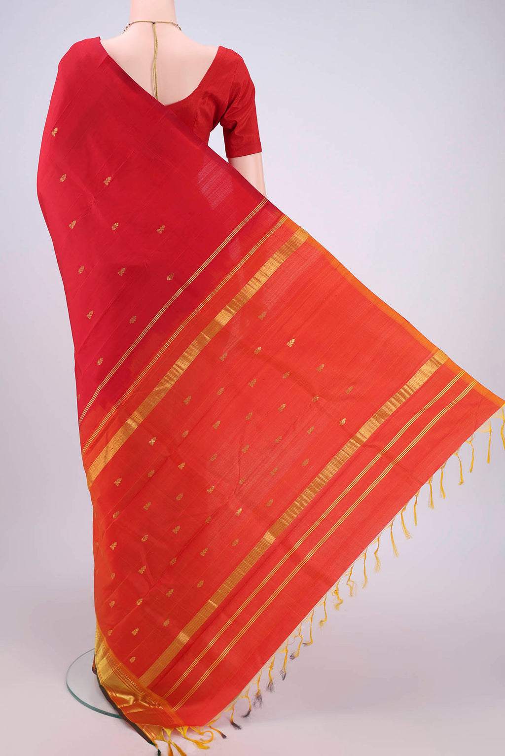 Flat view of Red Kanjivaram Silk Saree with Zari Butta on the body and One Side Border. 