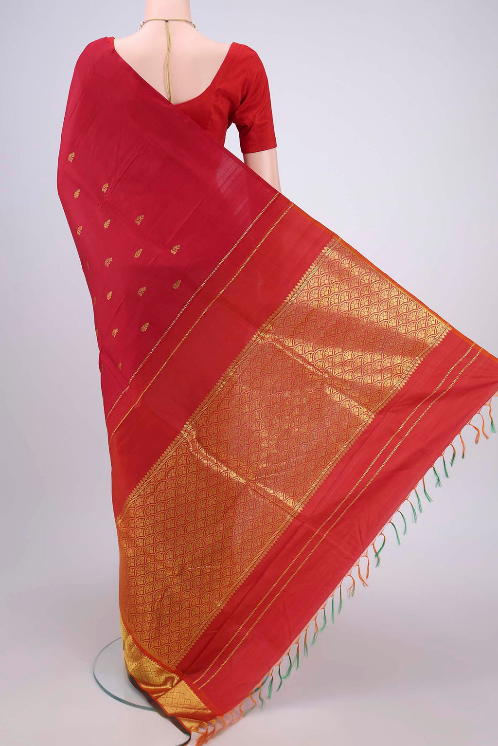 Flat view of Red Kanjivaram Silk Saree with Zari Butta on the body and One Side Border. 