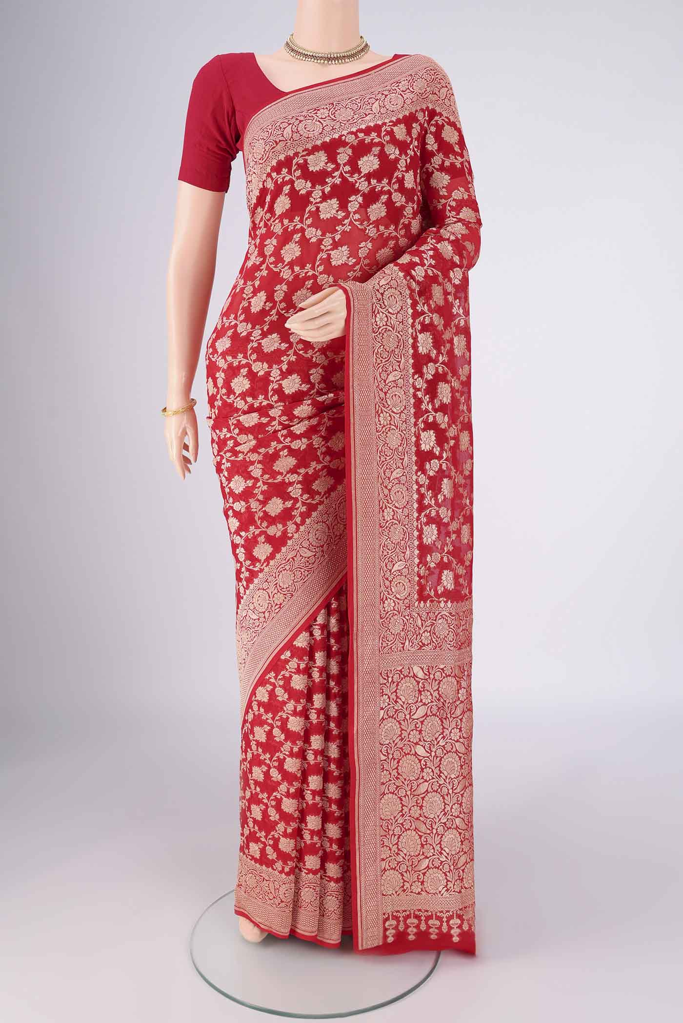 Red Banarasi Georgette Saree with Zari Brocade on the body and Zari Border.  displayed on a mannequin